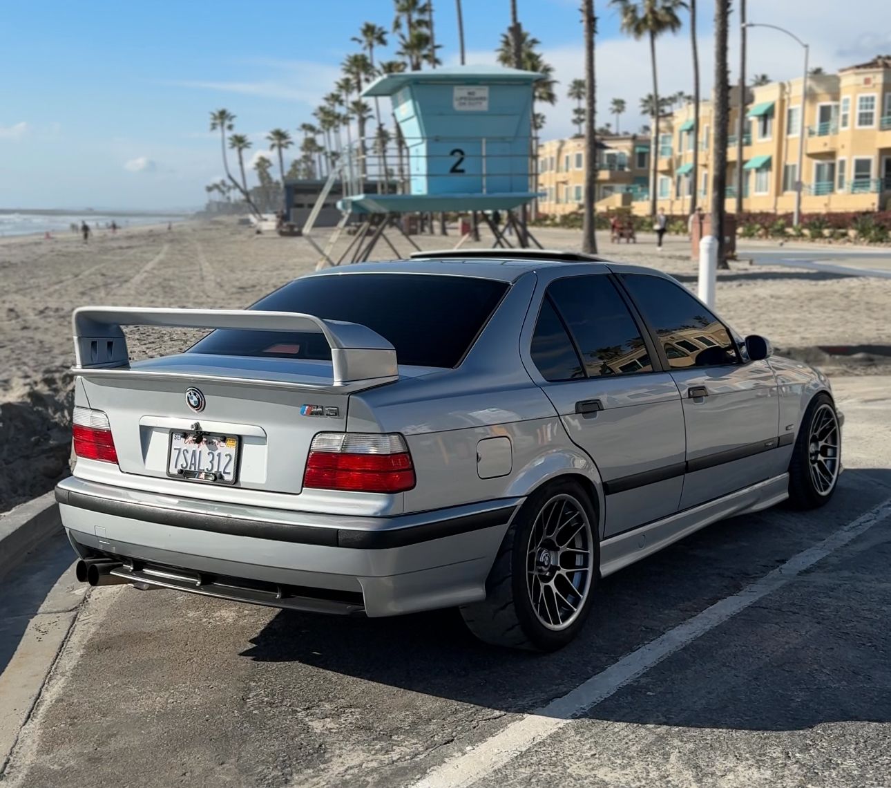 Silver BMW E36 M3 with 17" ARC-8 Apex wheels in Hyper Black