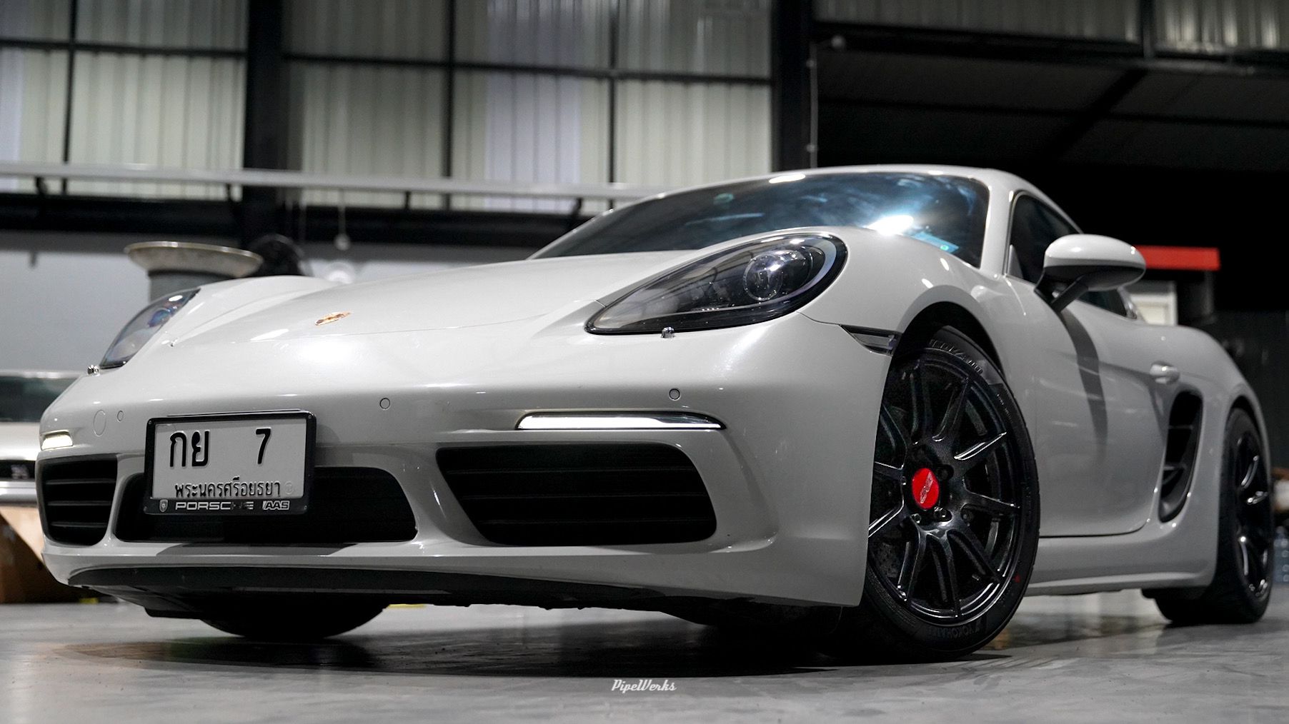 White Porsche 718 Cayman Base with 18" SM-10 Apex wheels in Satin Black