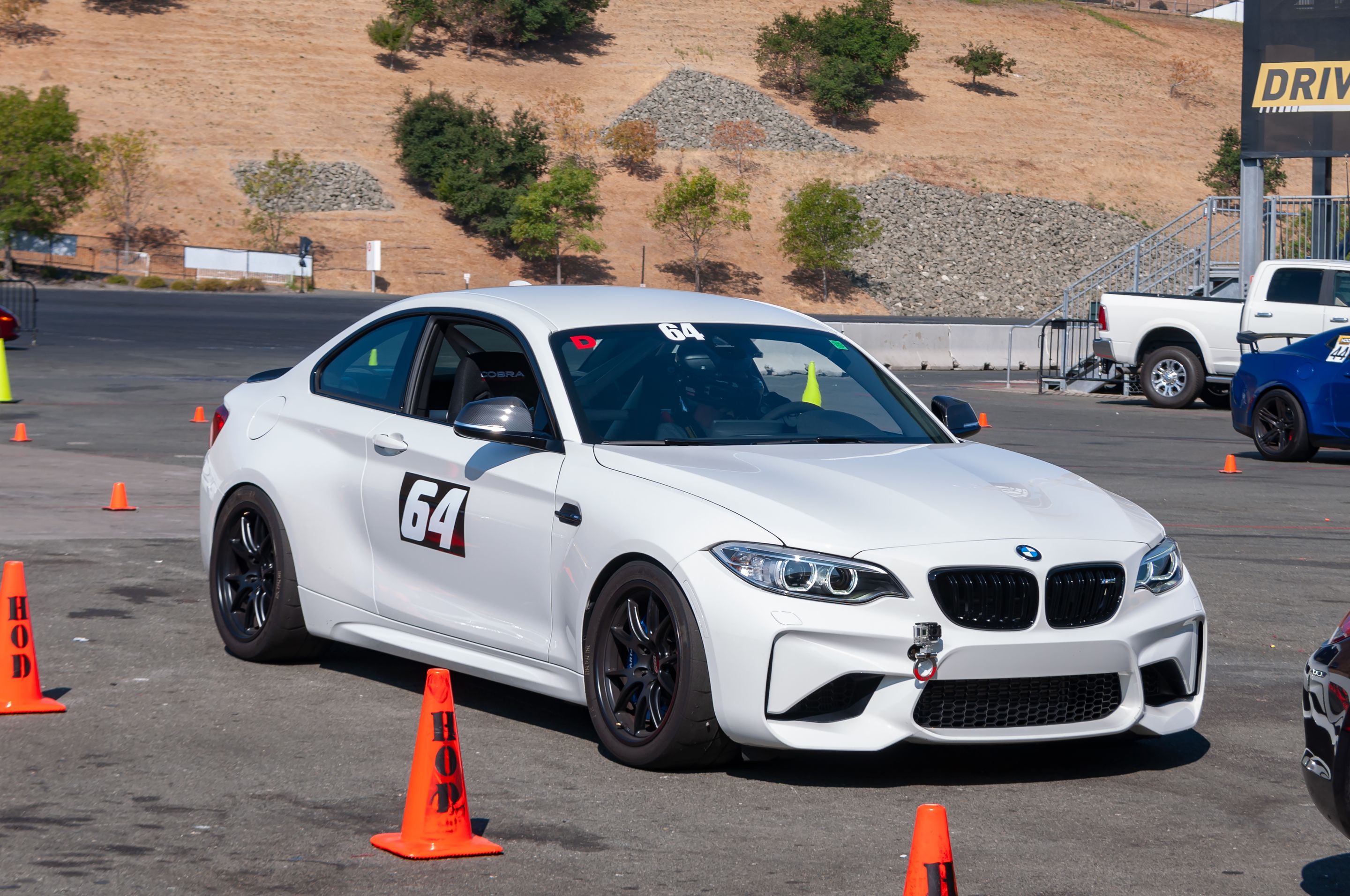 White BMW F87 M2 with 18" FL-5 Apex wheels in Satin Black