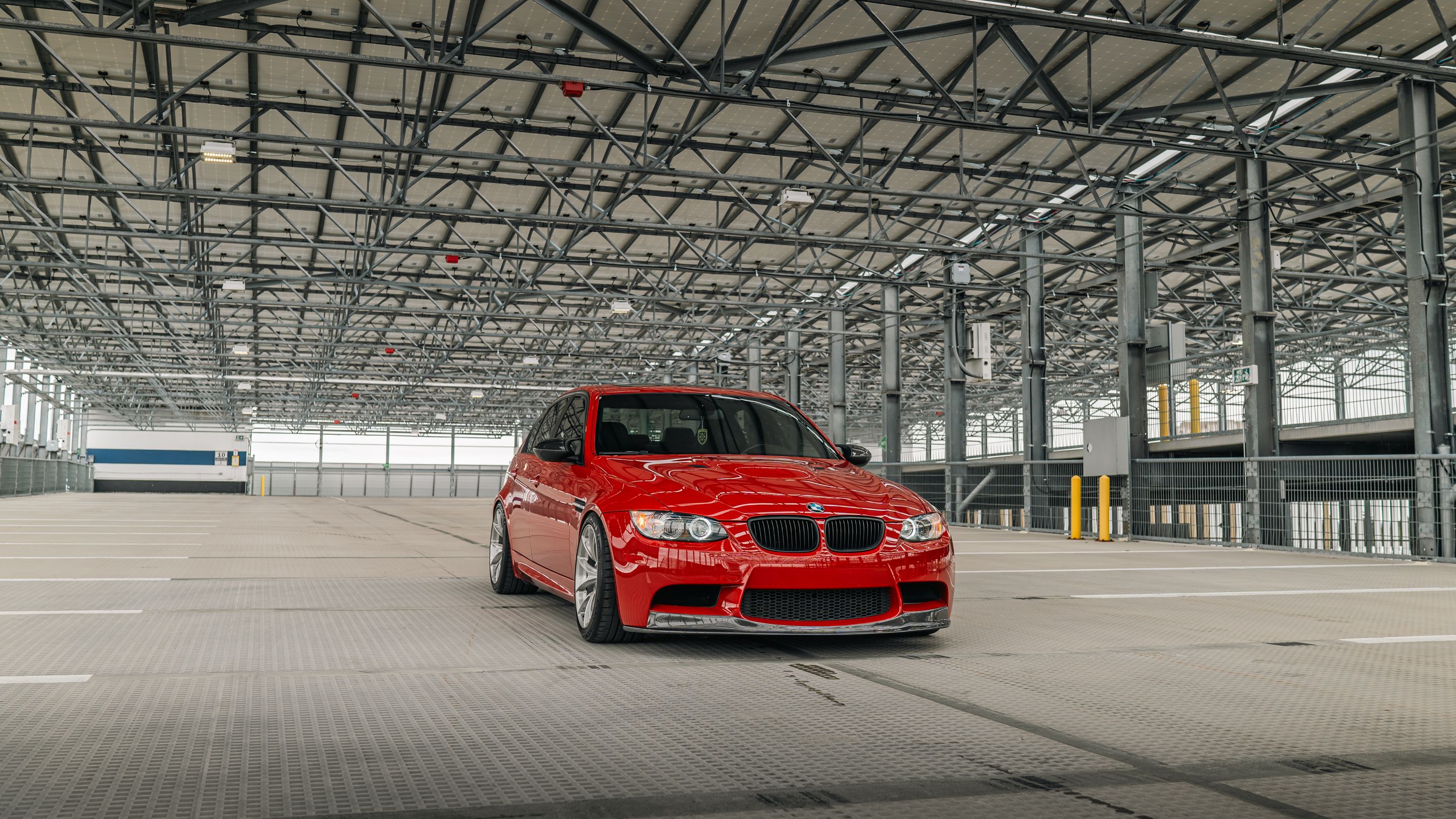Red BMW E90 Sedan M3 with 18" VS-5RS Apex wheels in Brushed Clear