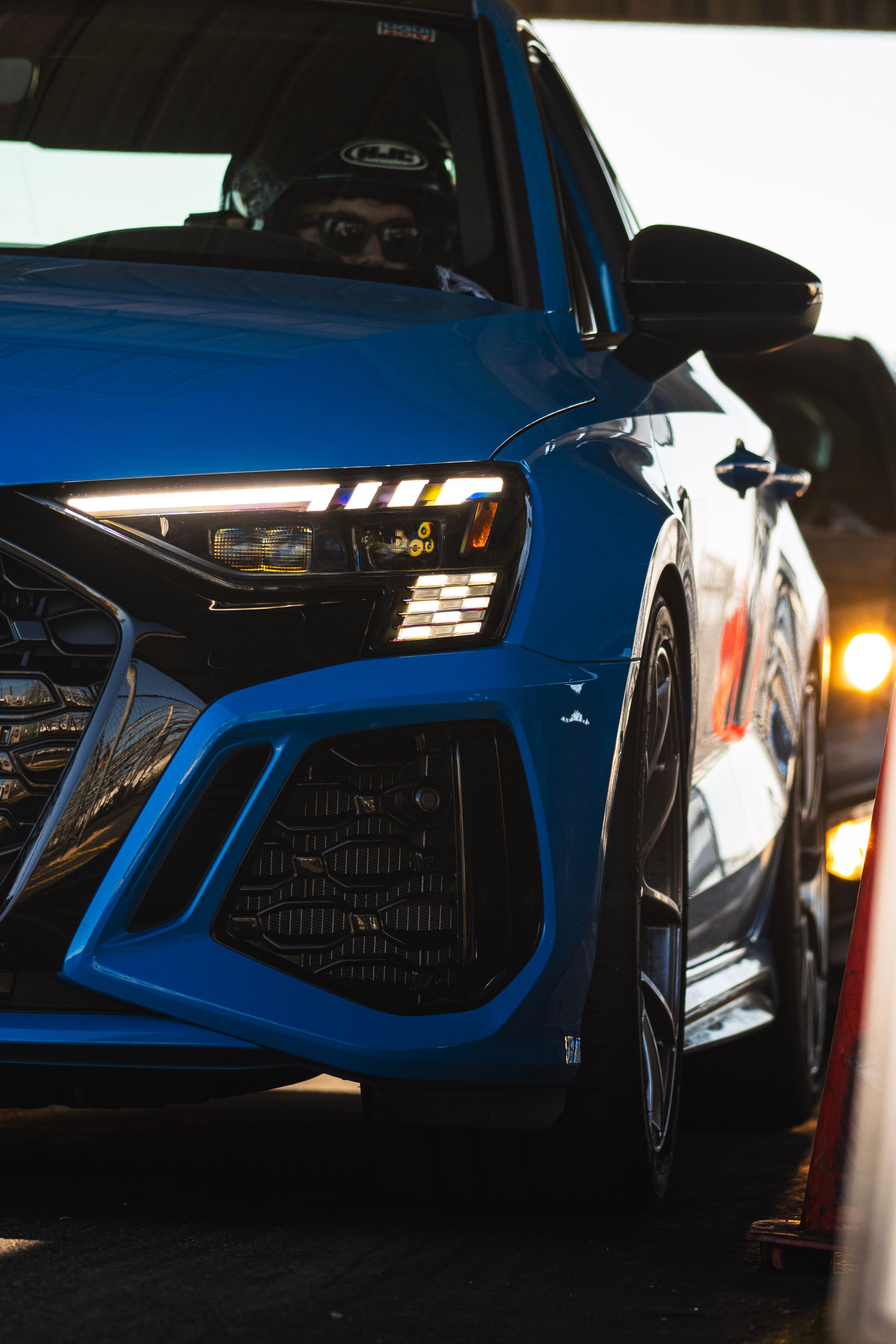 Blue Audi 8Y RS 3 with 18" VS-5RS Apex wheels in Brushed Clear