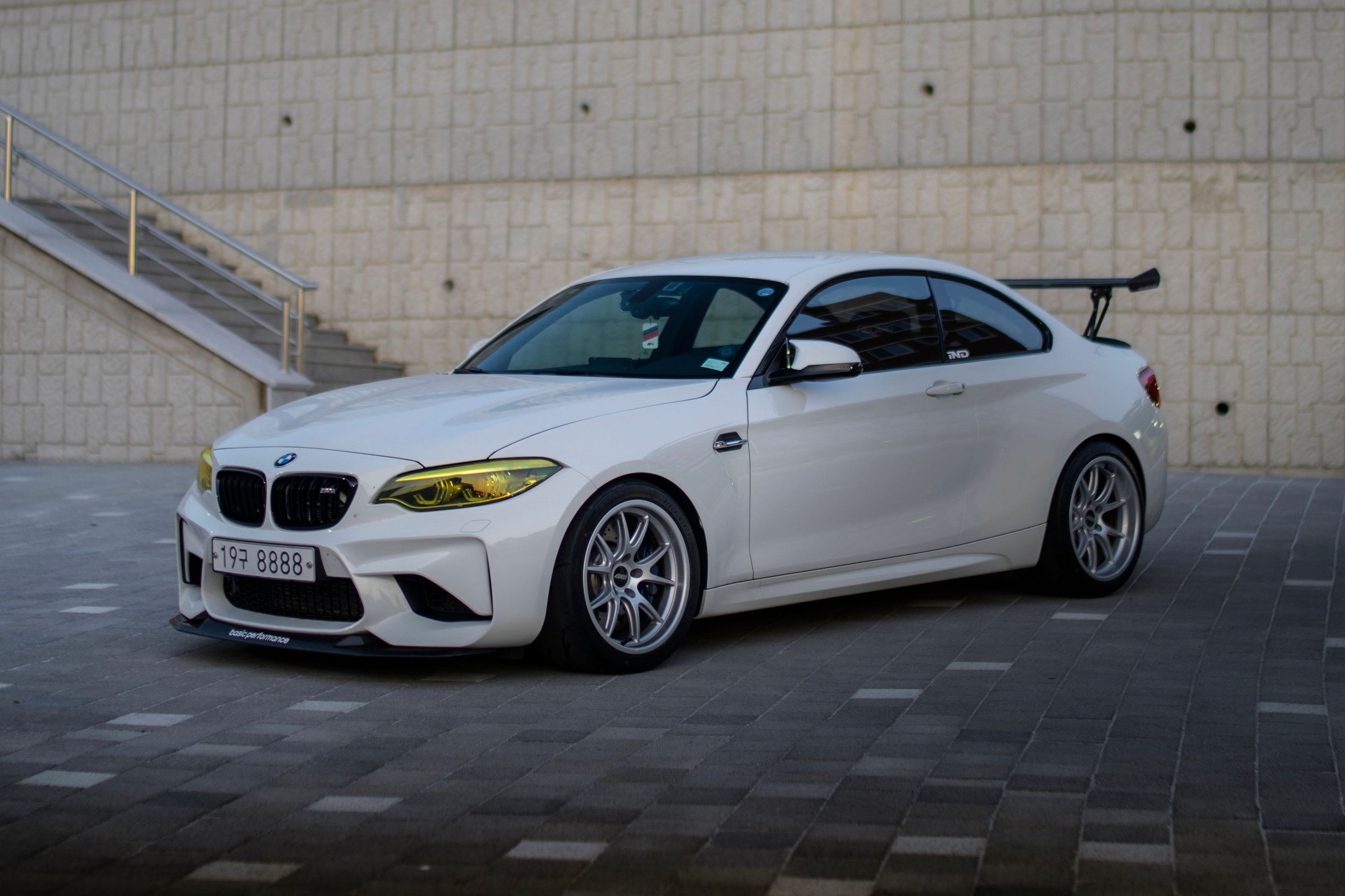 White BMW F87 M2 with 18" FL-5 Apex wheels in Race Silver