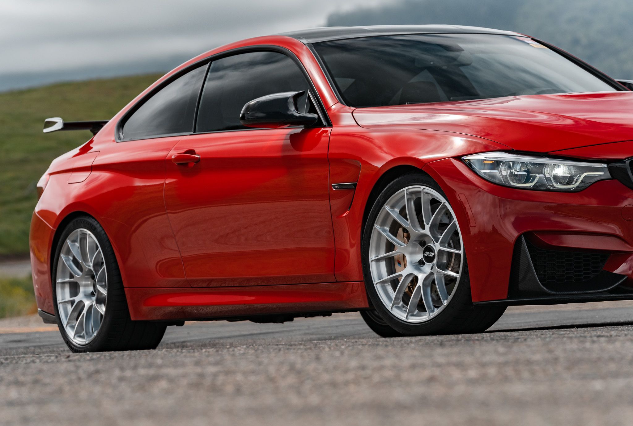 Red BMW F82 Coupe M4 with 19" EC-7RS Apex wheels in Brushed Clear