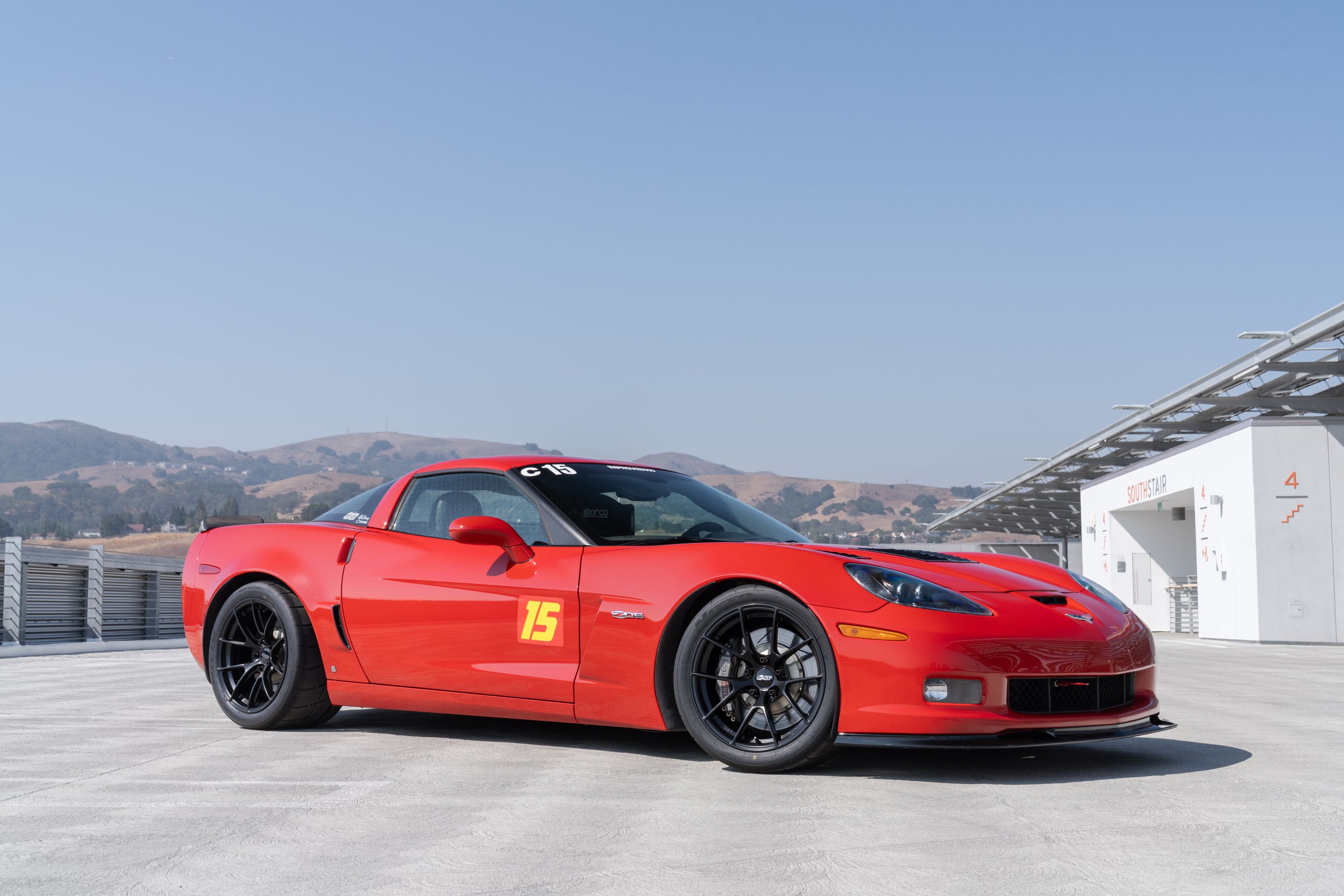 Red Chevrolet C6 Corvette Z06 with 18" VS-5RS Apex wheels in Satin Black