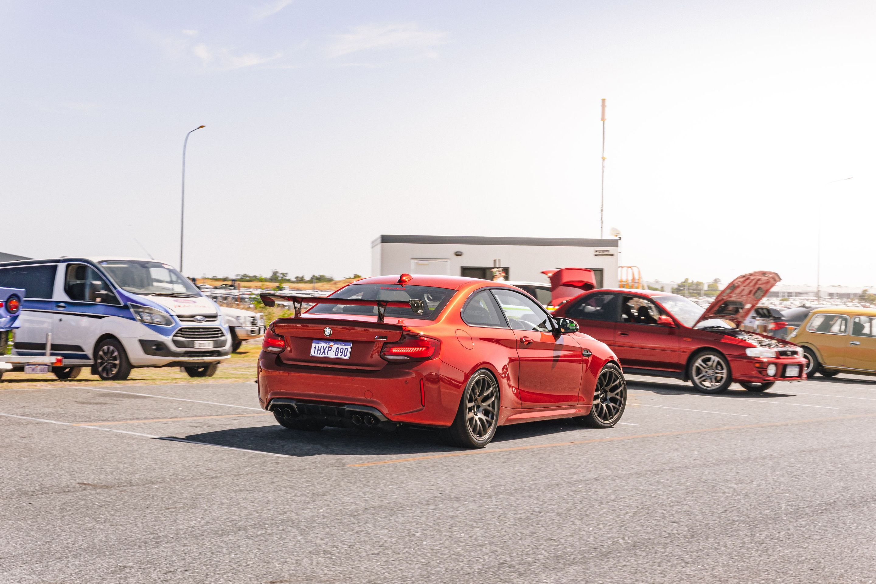 Orange BMW F87 M2 with 19" EC-7 Apex wheels in Anthracite