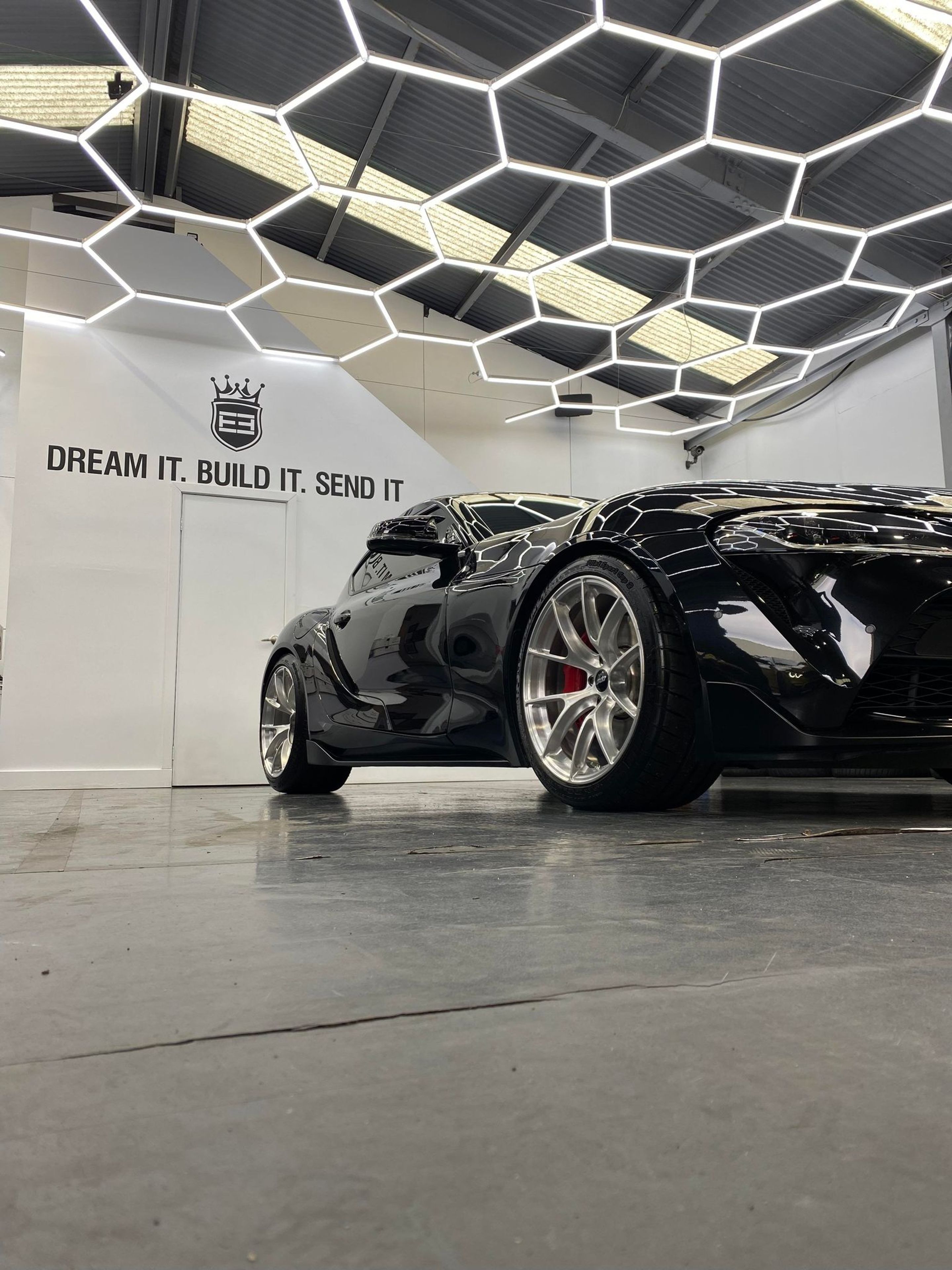 Black Toyota GR Supra with 19" VS-5RS Apex wheels in Brushed Clear