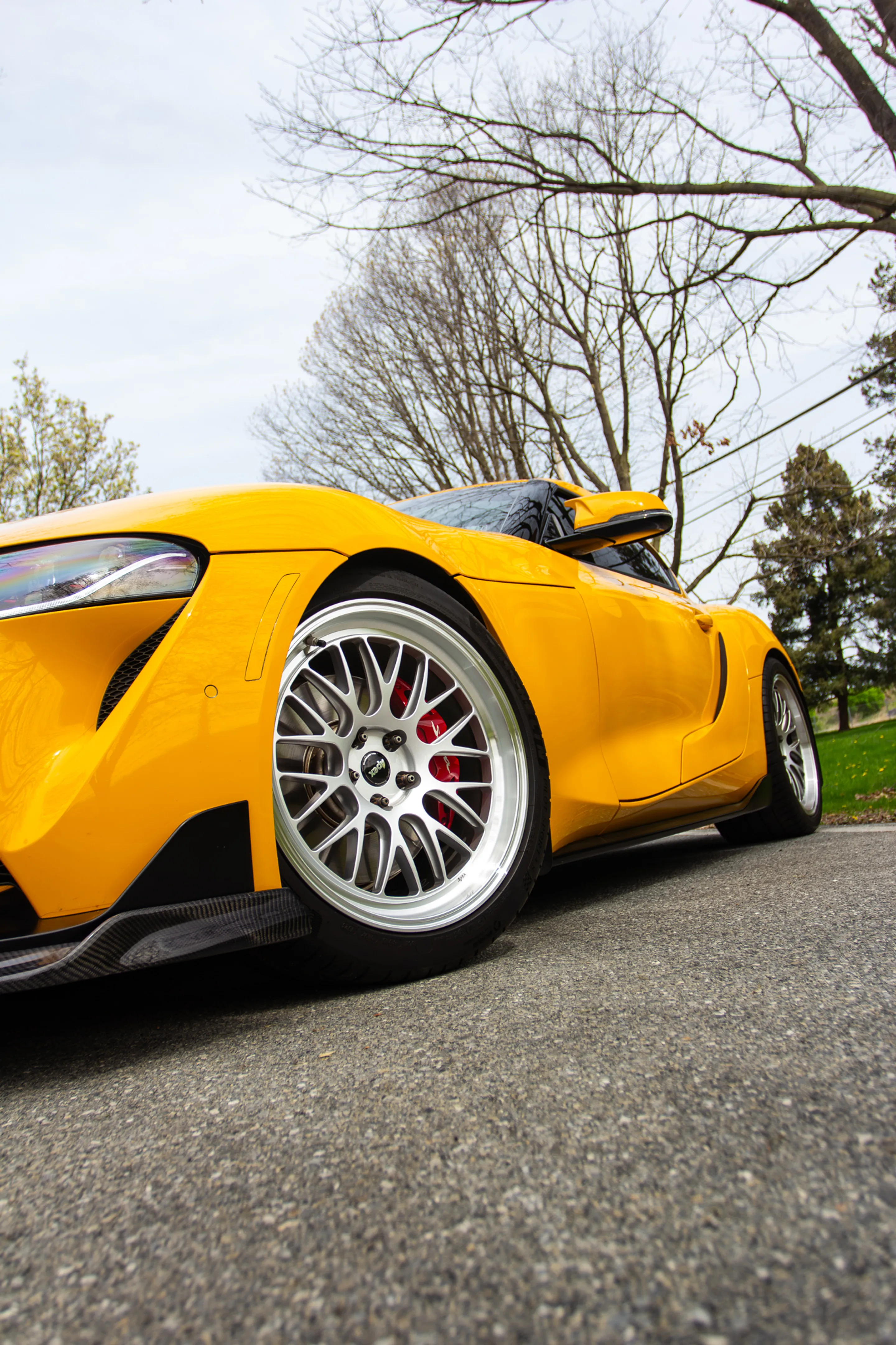Yellow Toyota GR Supra with 19" ML-10RT Apex wheels in Machined Lip Race Silver
