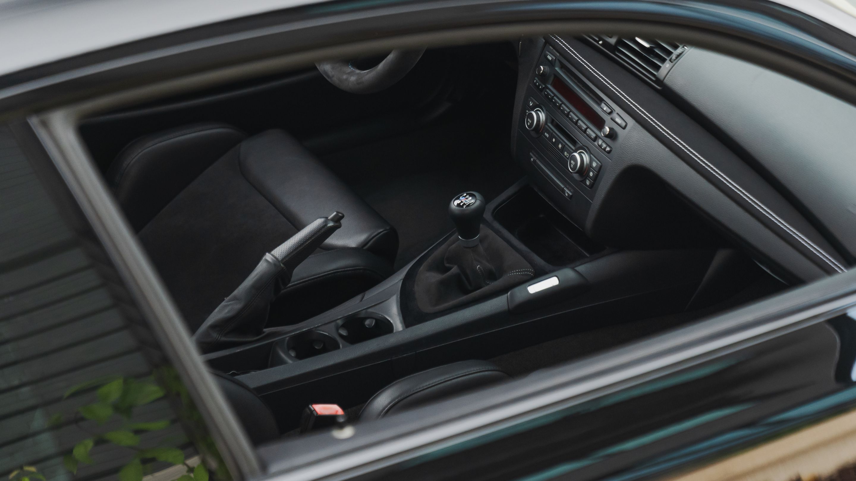 Black BMW E82 Coupe 1 Series with 18" VS-5RS Apex wheels in Motorsport Gold