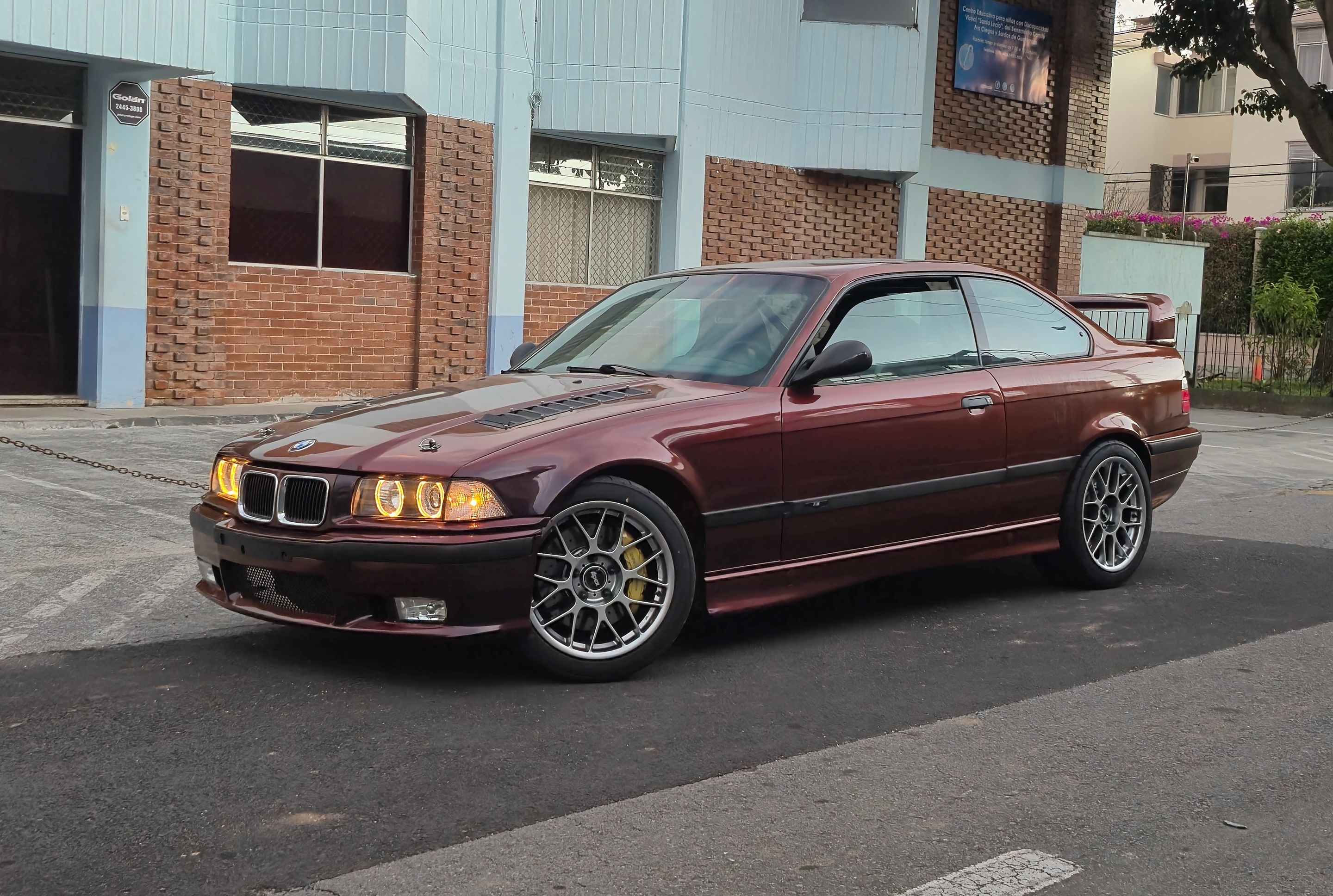 Red BMW E36 3 Series with 17" ARC-8 Apex wheels in Hyper Black