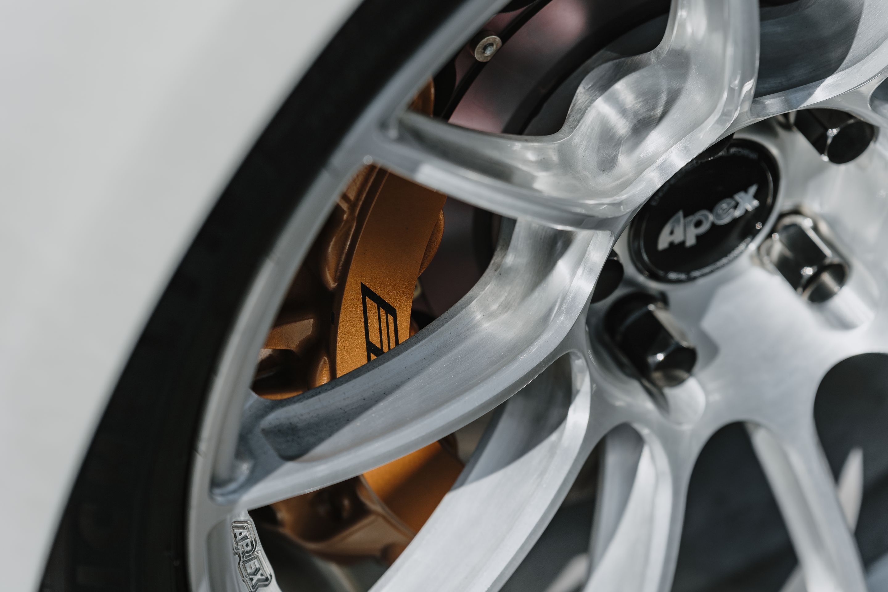 White Cadillac Gen 3 CTS-V with 19" SM-10RS Apex wheels in Brushed Clear