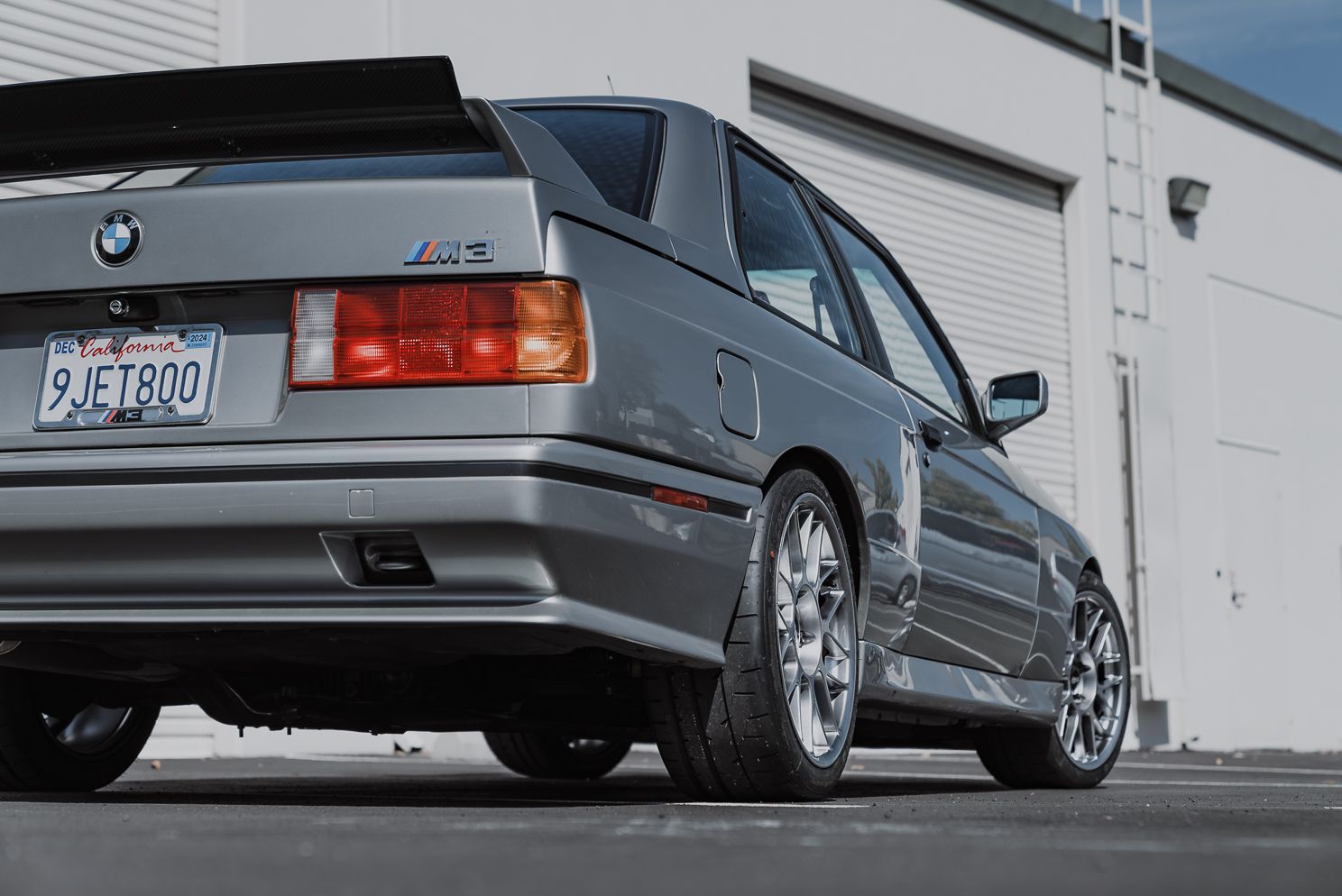 Silver BMW E30 M3 with 17" ARC-8 Apex wheels in Hyper Black