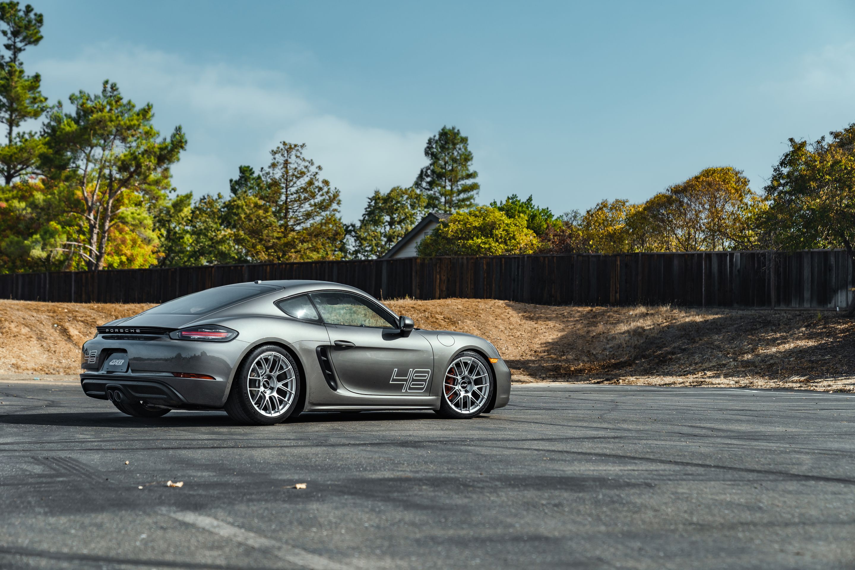 Grey Porsche 718 Cayman S with 19" EC-7RS Apex wheels in Race Silver