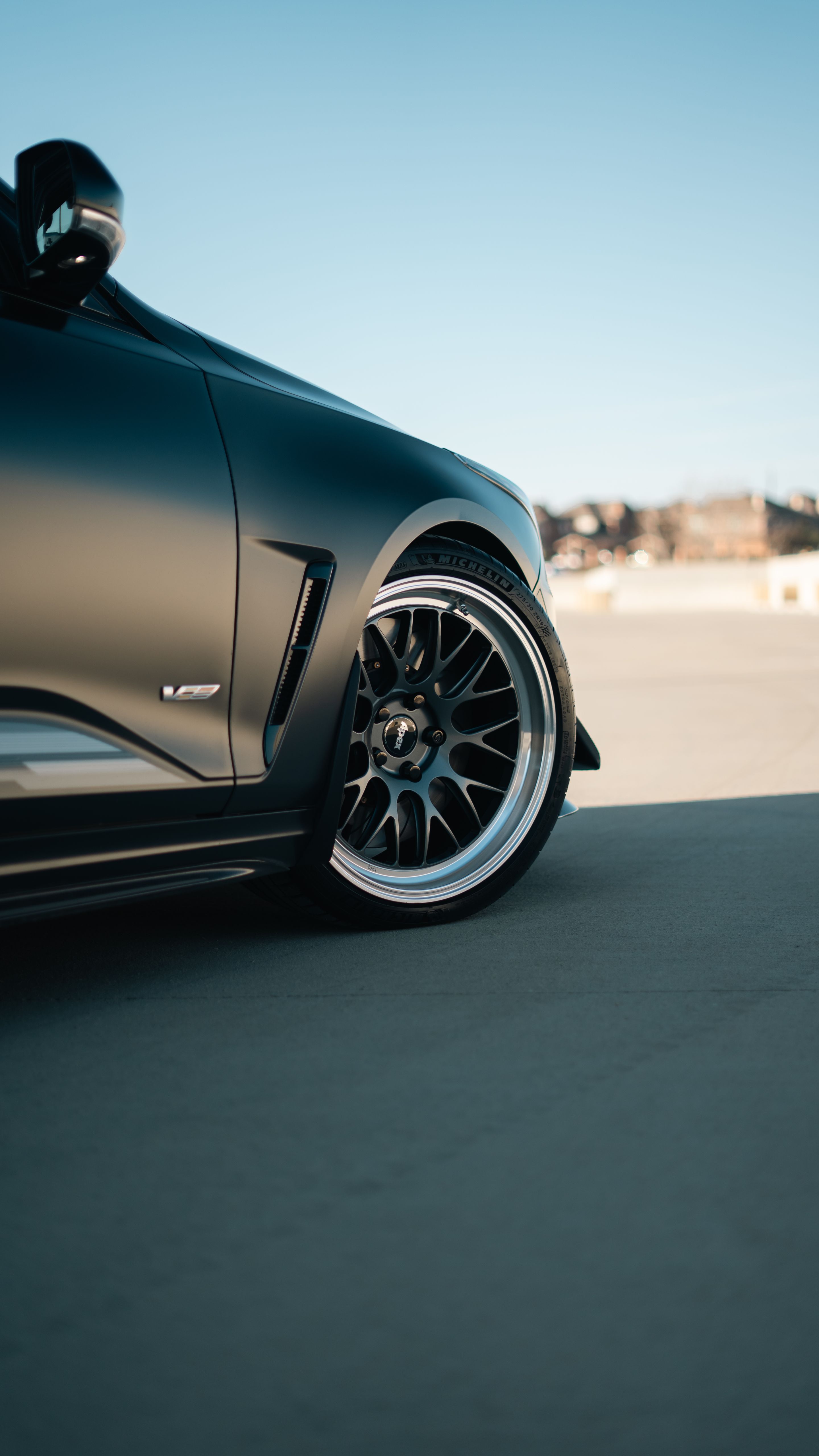 Black Cadillac CT4-V Blackwing with 19" ML-10RT Apex wheels in Machined Lip Anthracite
