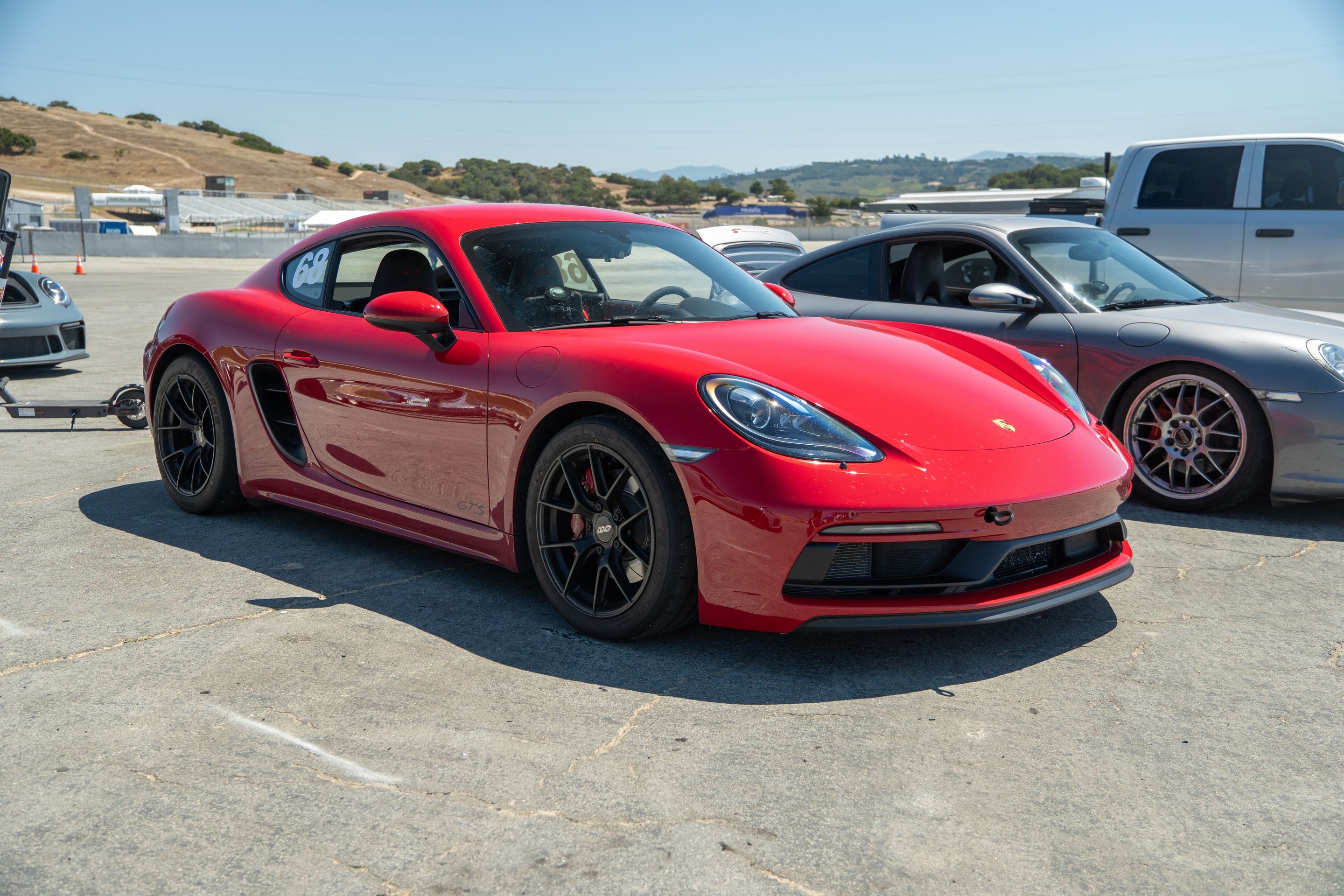 Red Porsche 718 Cayman GTS 2.5L with 18" VS-5RS Apex wheels in Satin Black