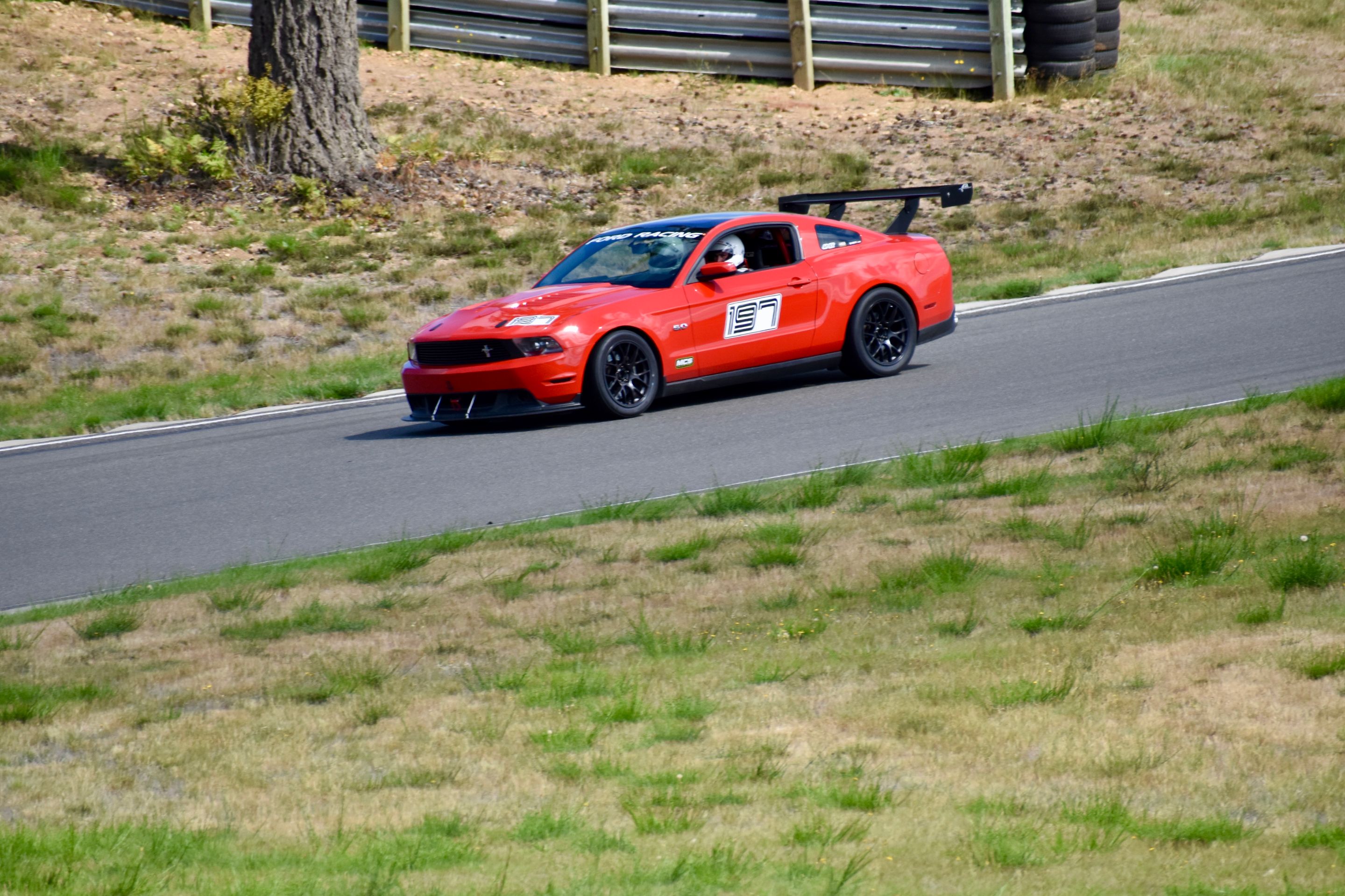 Red Ford S197 Mustang GT with 18" EC-7 Apex wheels in Satin Black