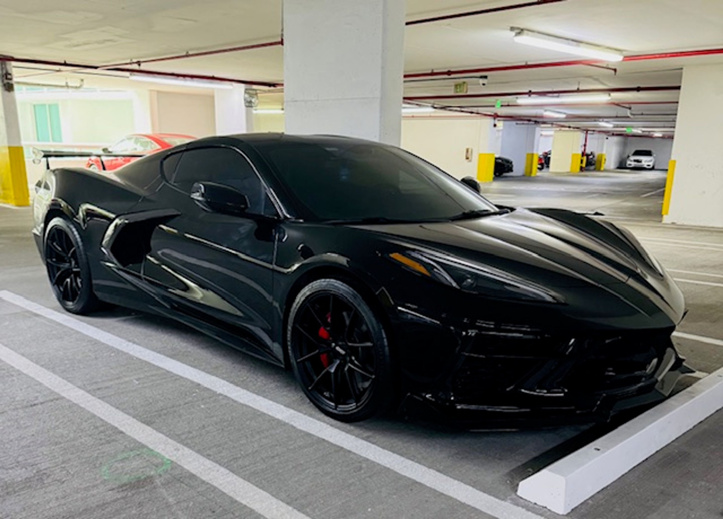Black Chevrolet C8 Corvette Z06 with 20"/21" VS-5RS Apex wheels in Satin Black