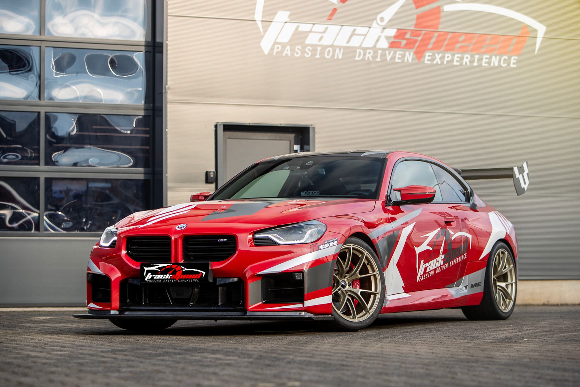 Red BMW G87 M2 with 19" VS-5RS Apex wheels in Motorsport Gold