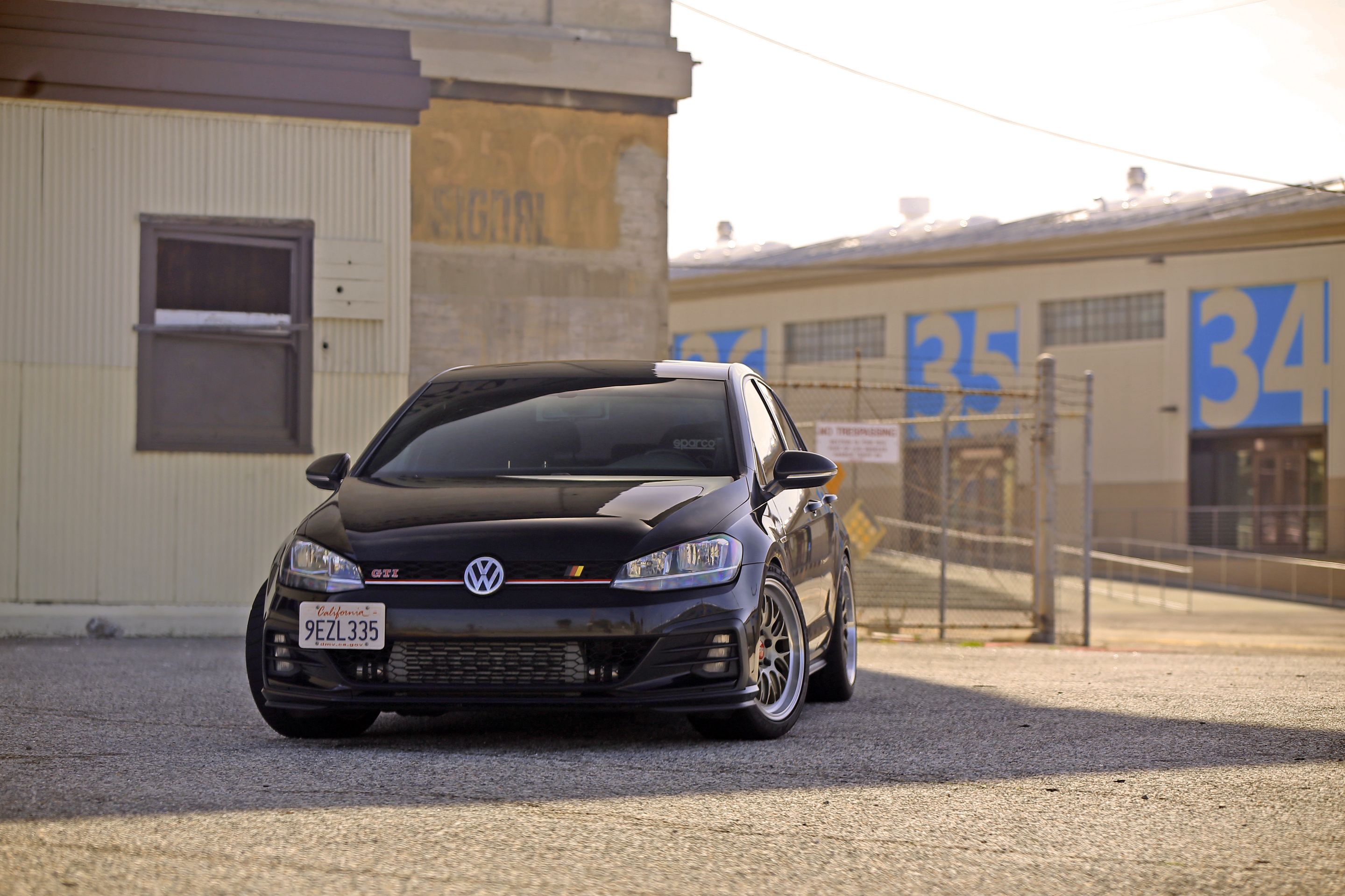 Black VW MK7 GTI with 18" ML-10RT Apex wheels in Machined Lip Gloss Motorsport Gold