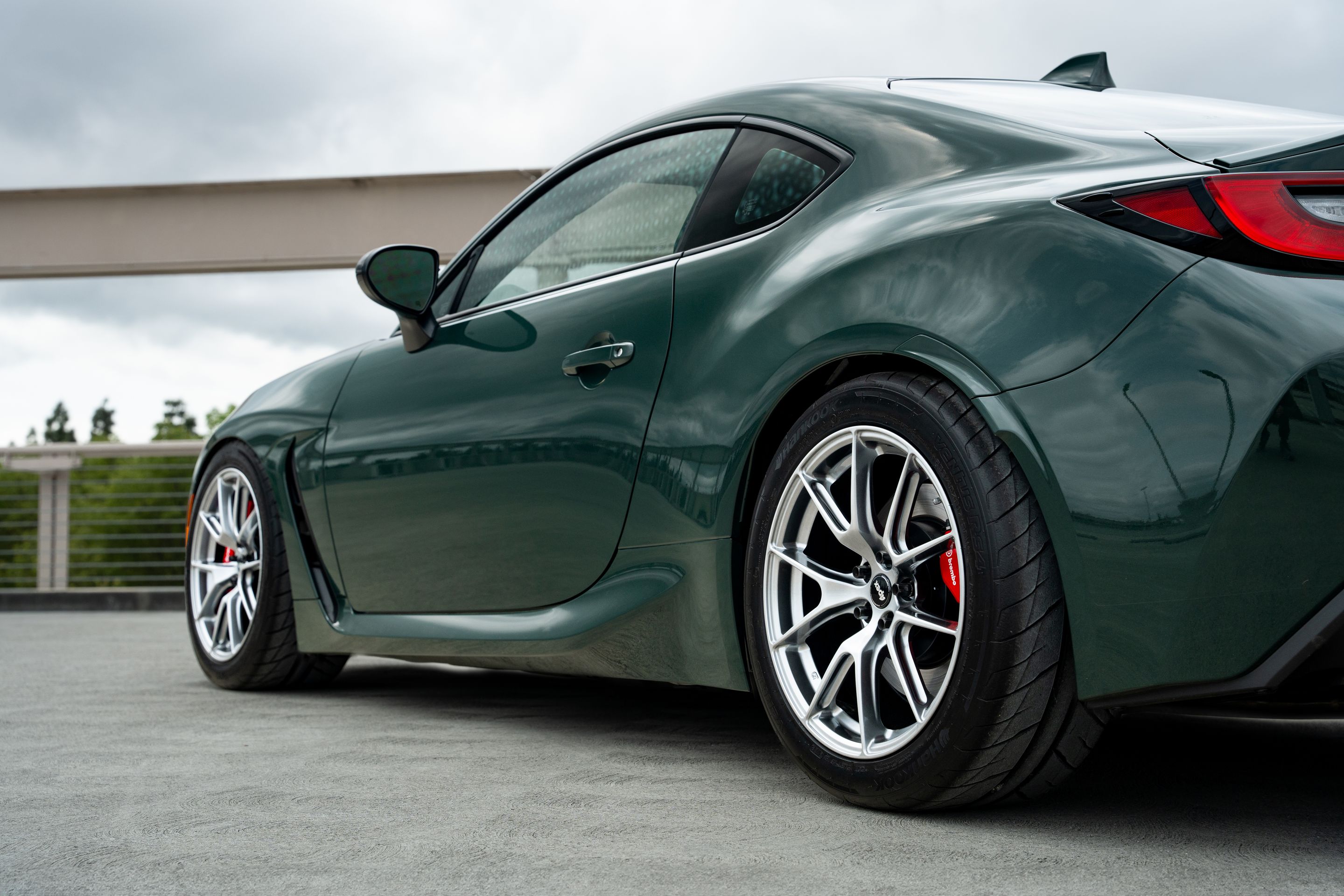 Green Toyota GR86 with 17" VS-5 Apex wheels in Hyper Black