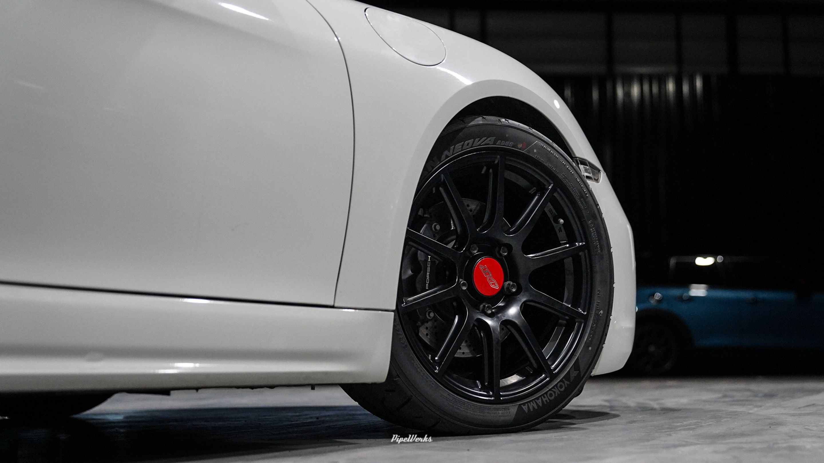 White Porsche 718 Cayman Base with 18" SM-10 Apex wheels in Satin Black