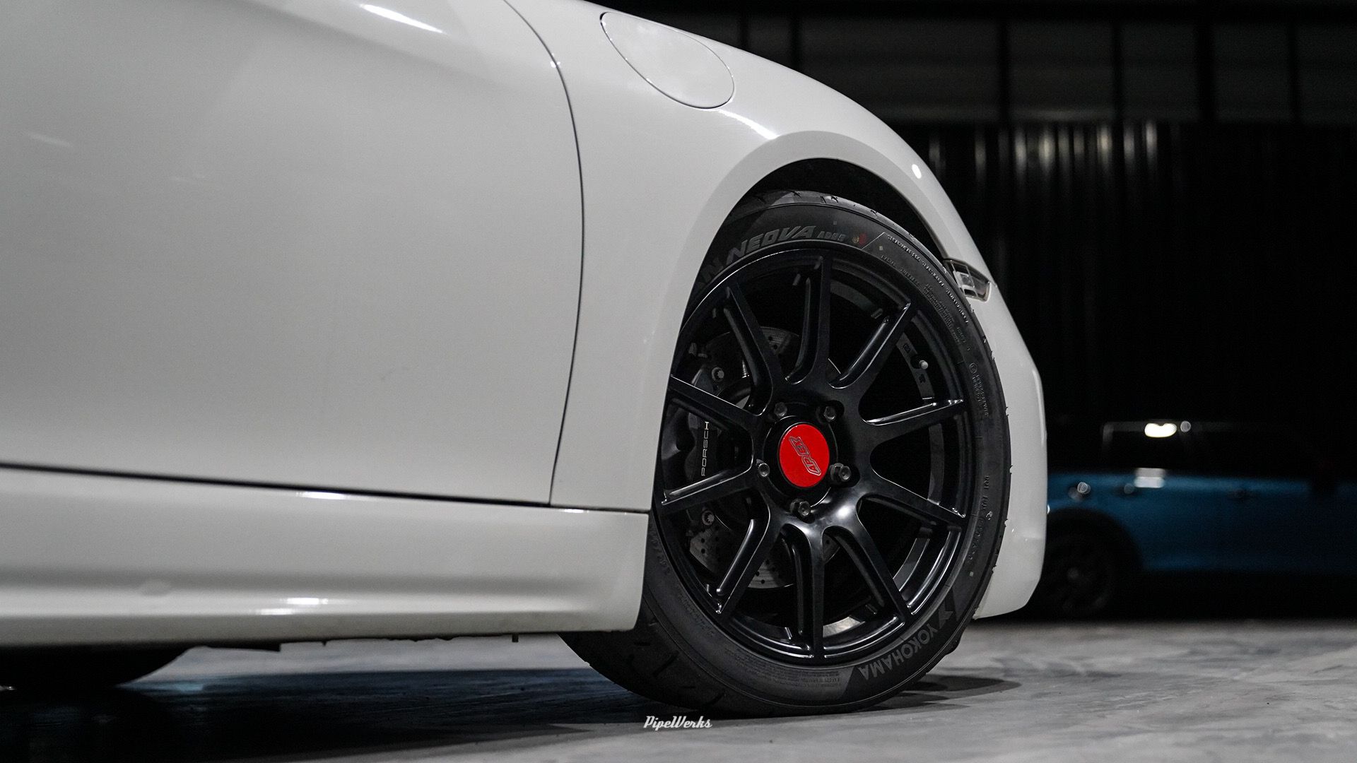 White Porsche 718 Cayman Base with 18" SM-10 Apex wheels in Satin Black