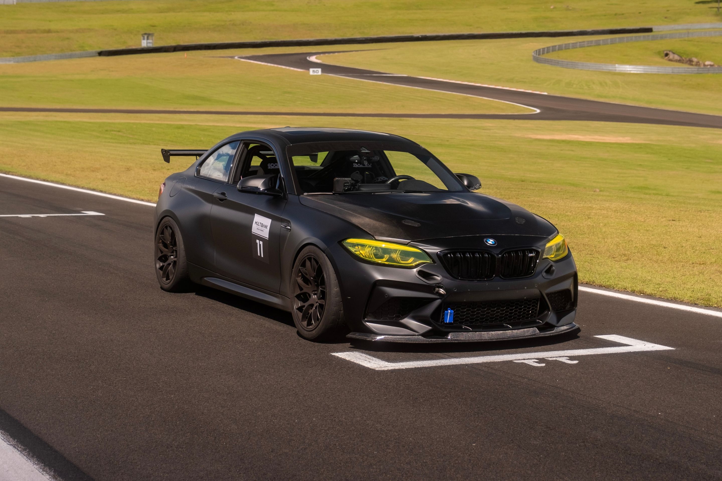 Black BMW F87 M2 with 18" EC-7 Apex wheels in Satin Black