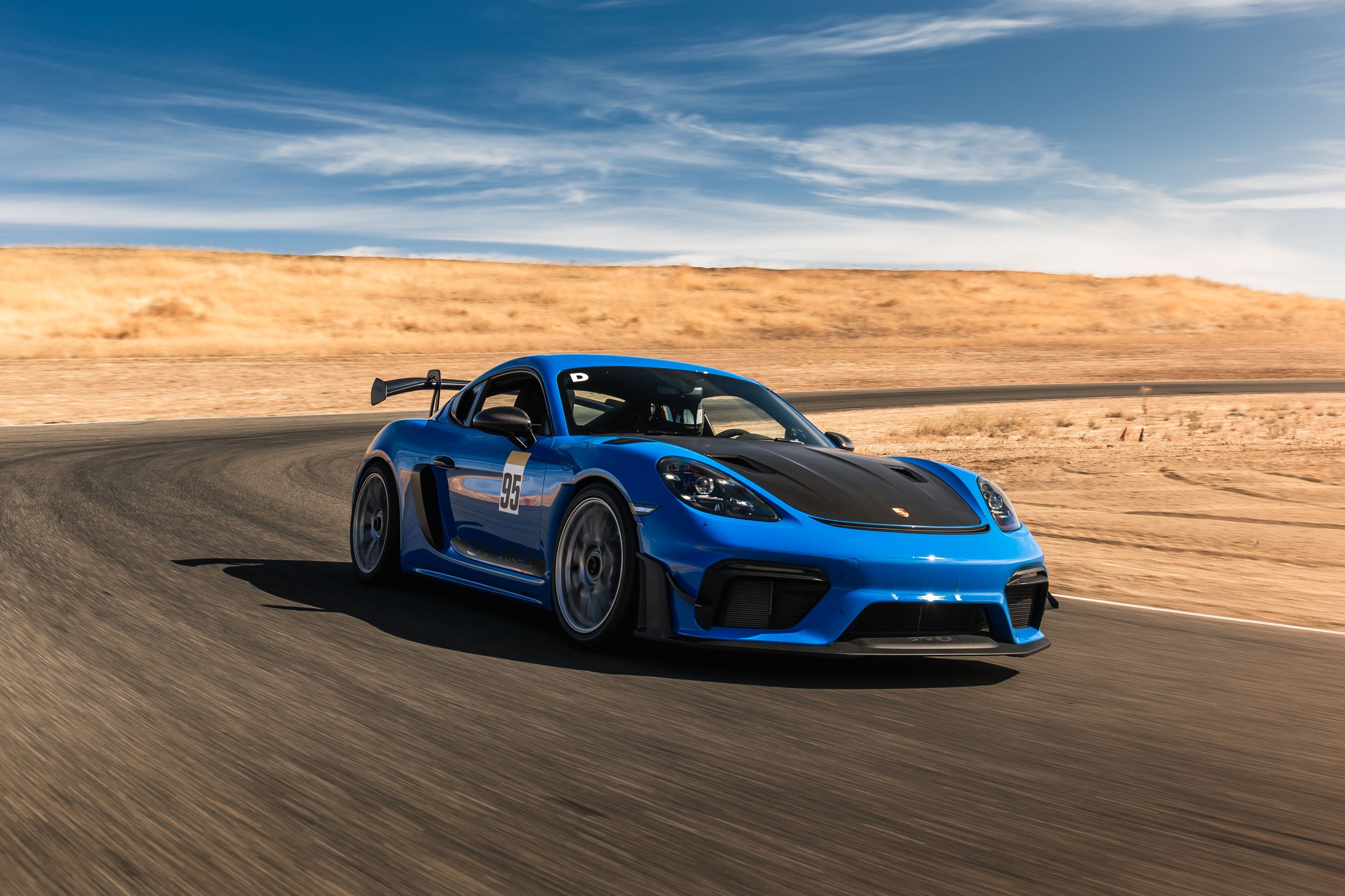 Blue Porsche 718 Cayman GT4 RS with 19" EC-7RS Apex wheels in Race Silver