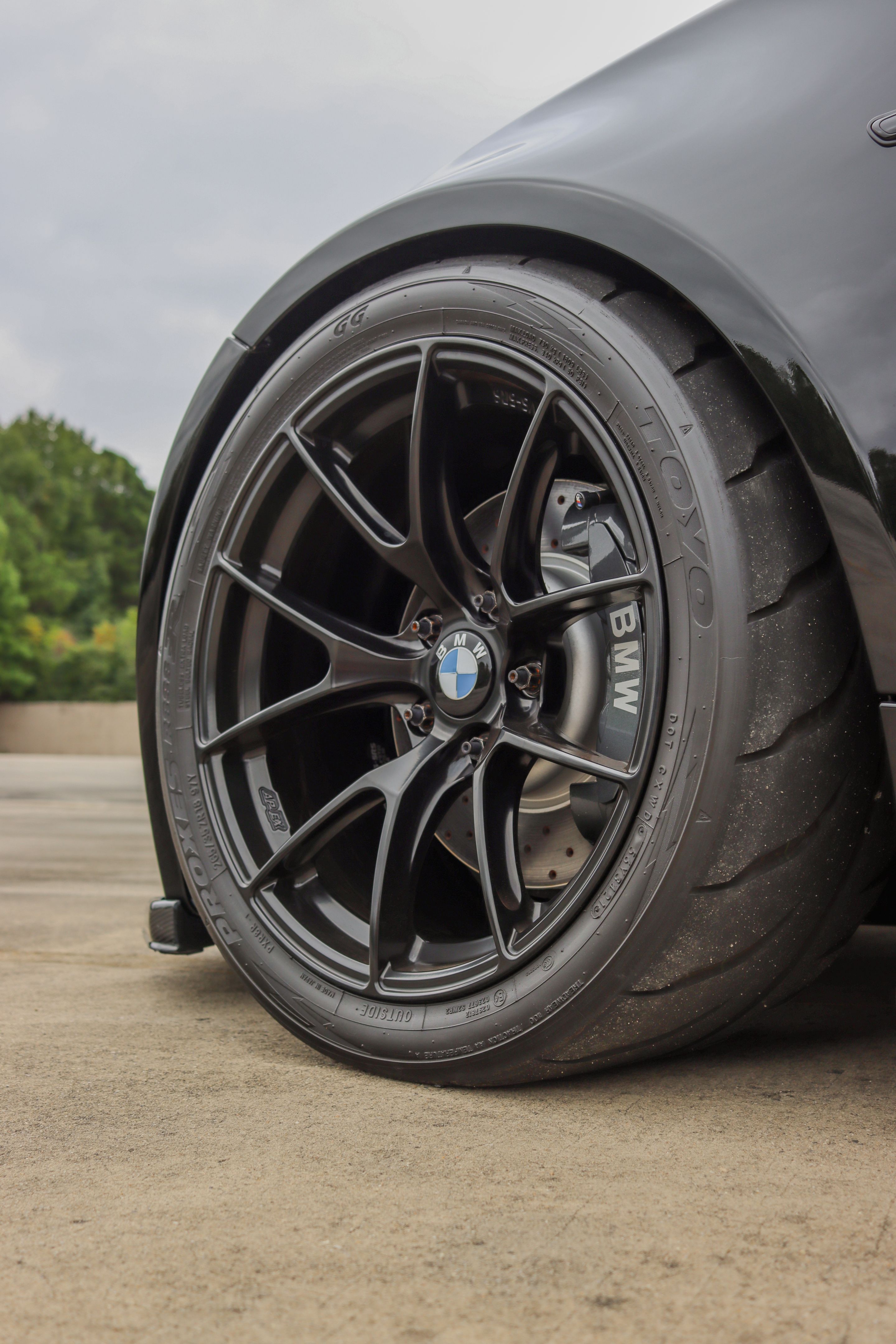 Black BMW E82 1M with 18" VS-5RS Apex wheels in Satin Black