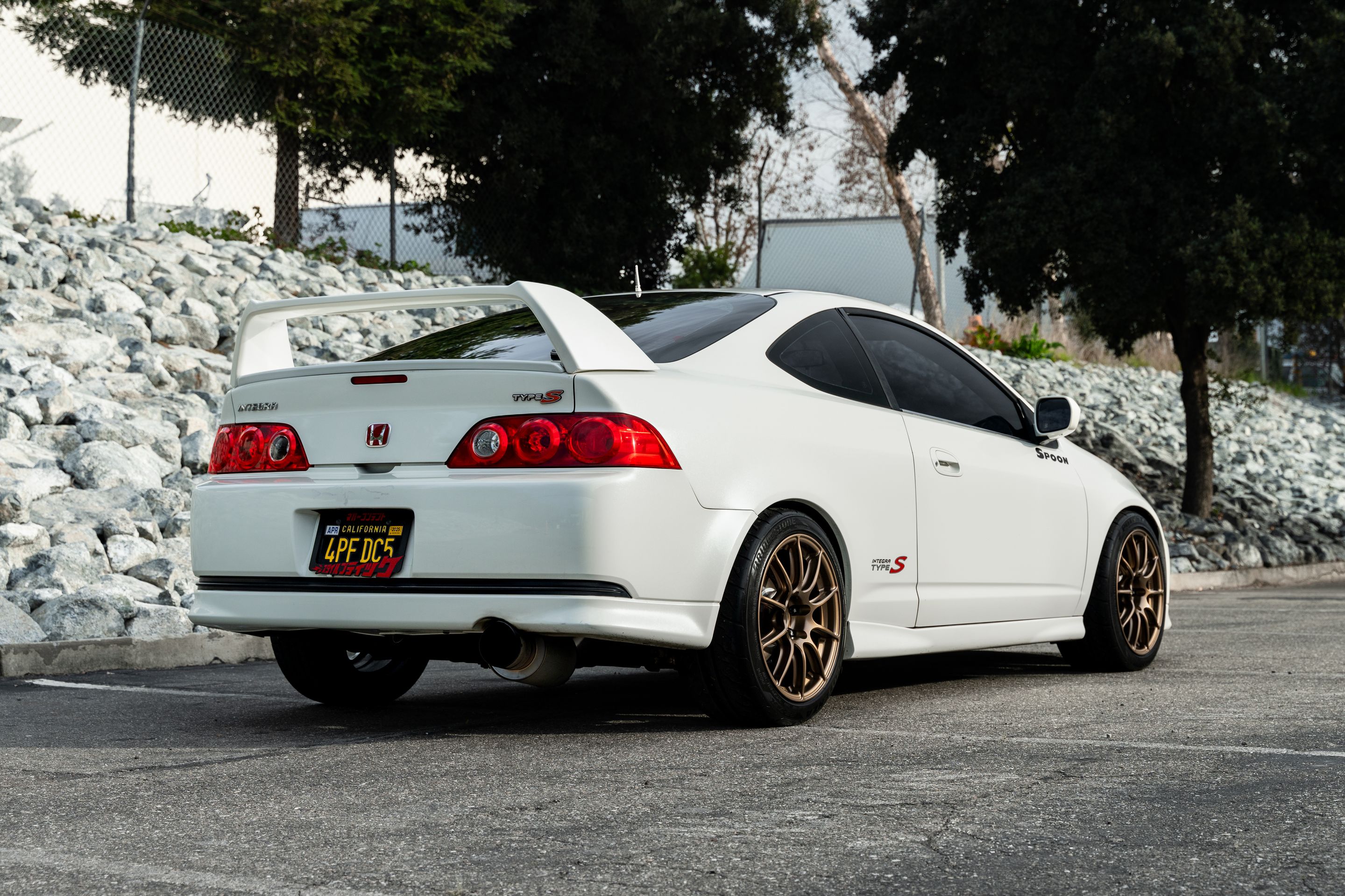 White Acura DC5 RSX with 17" SM-10RS Apex wheels in Satin Bronze