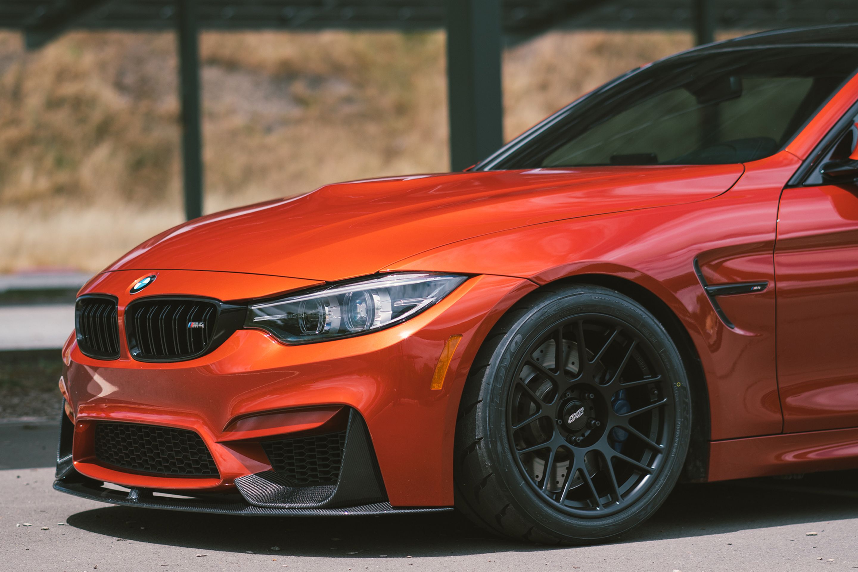 Red BMW F82 Coupe M4 with 18" ARC-8R Apex wheels in Satin Black