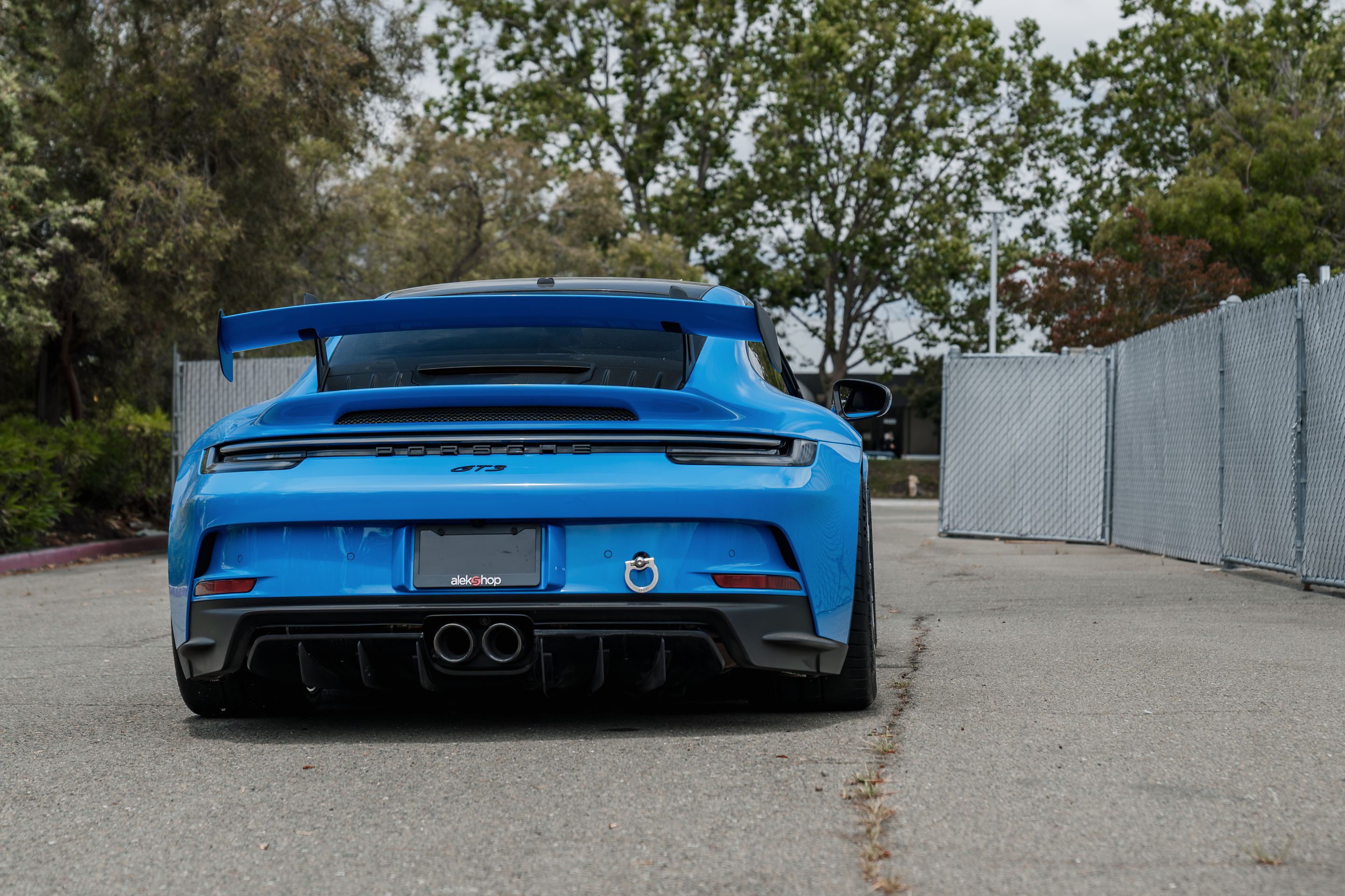 Blue Porsche 911 992.1 GT3 with 19" EC-7RS Apex wheels in Anthracite