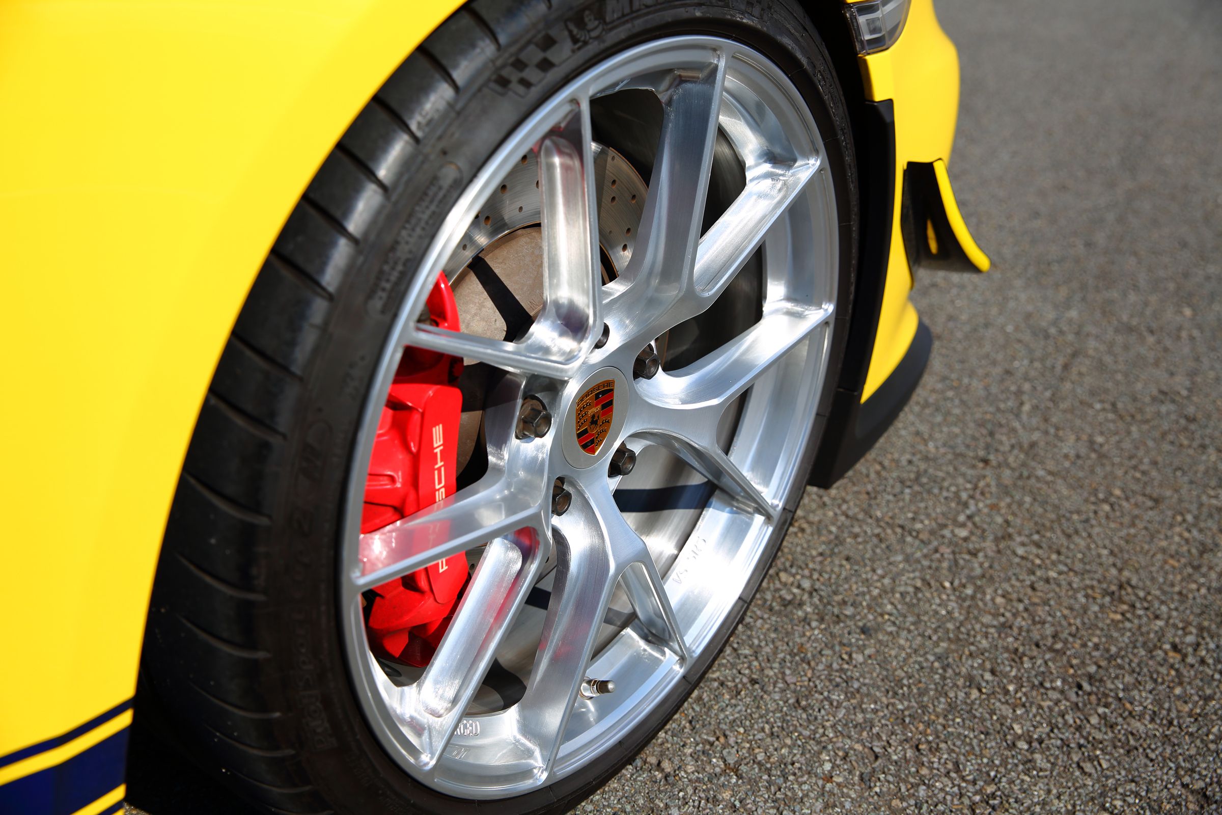 Yellow Porsche 981 Cayman GT4 with 20" VS-5RS Apex wheels in Brushed Clear