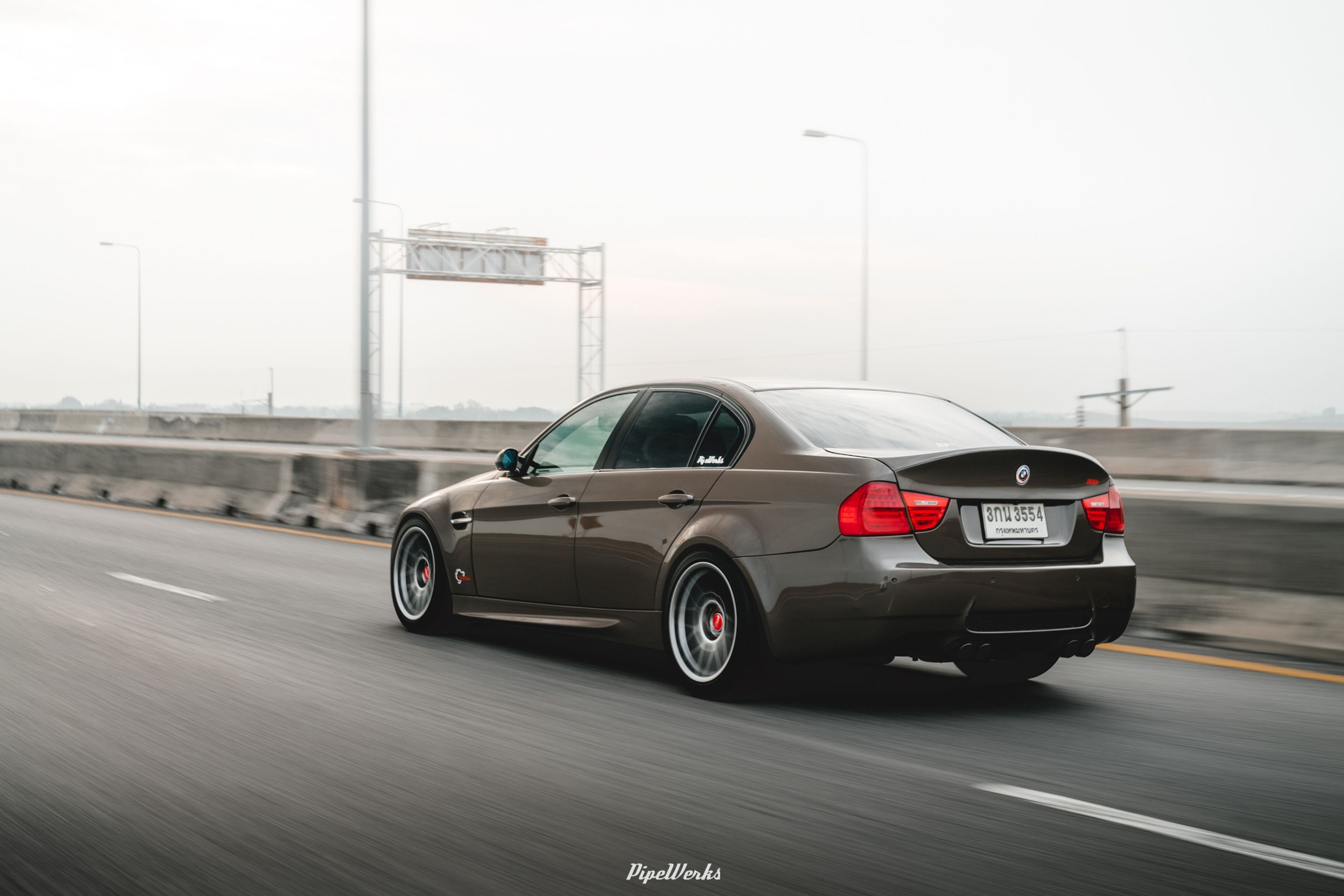 Brown BMW E90 Sedan 3 Series with 18" ARC-8 Apex wheels in Hyper Black