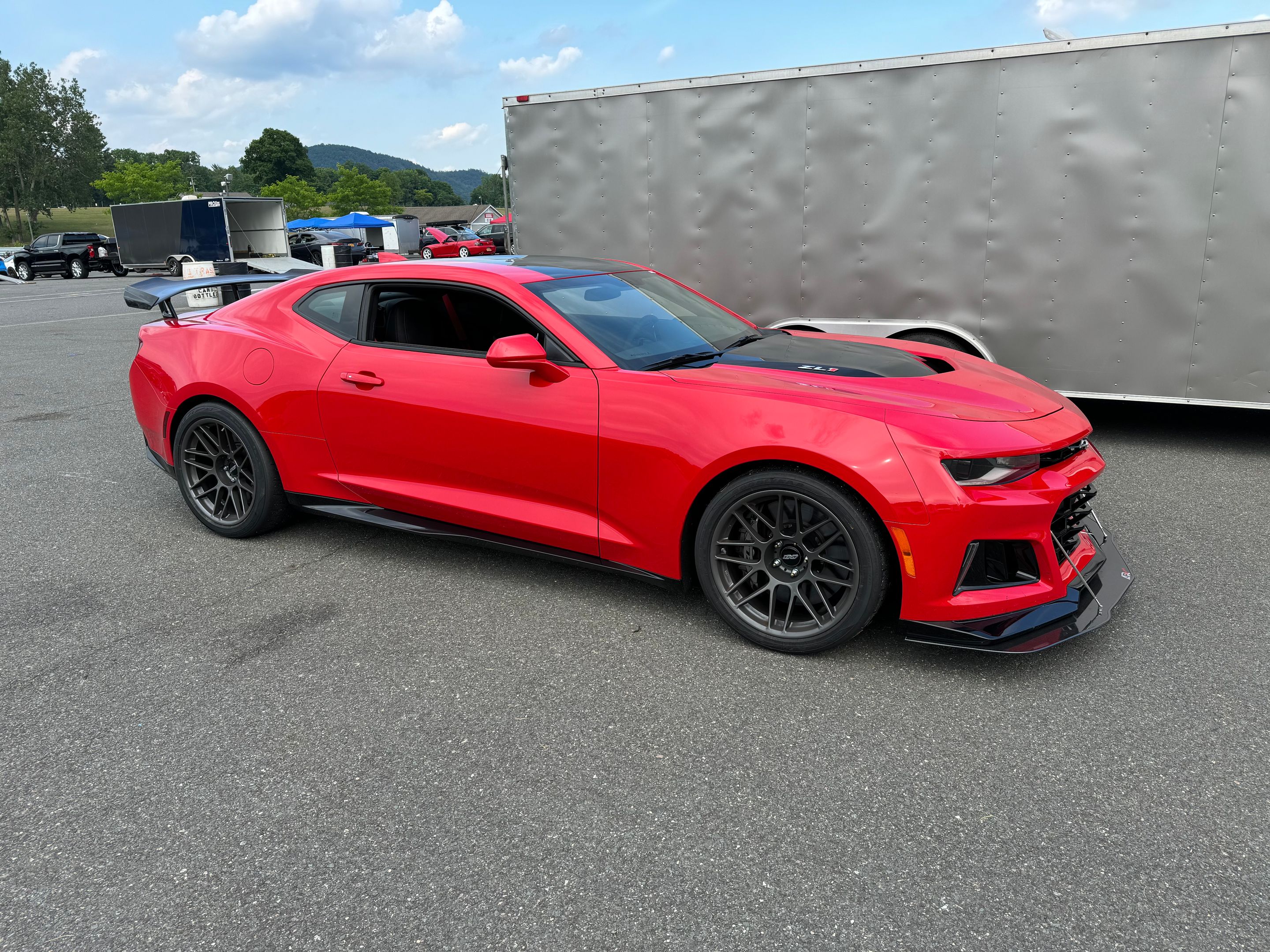 Red Chevrolet 6th Gen Camaro ZL1 1LE with 19" ARC-8 Apex wheels in Anthracite