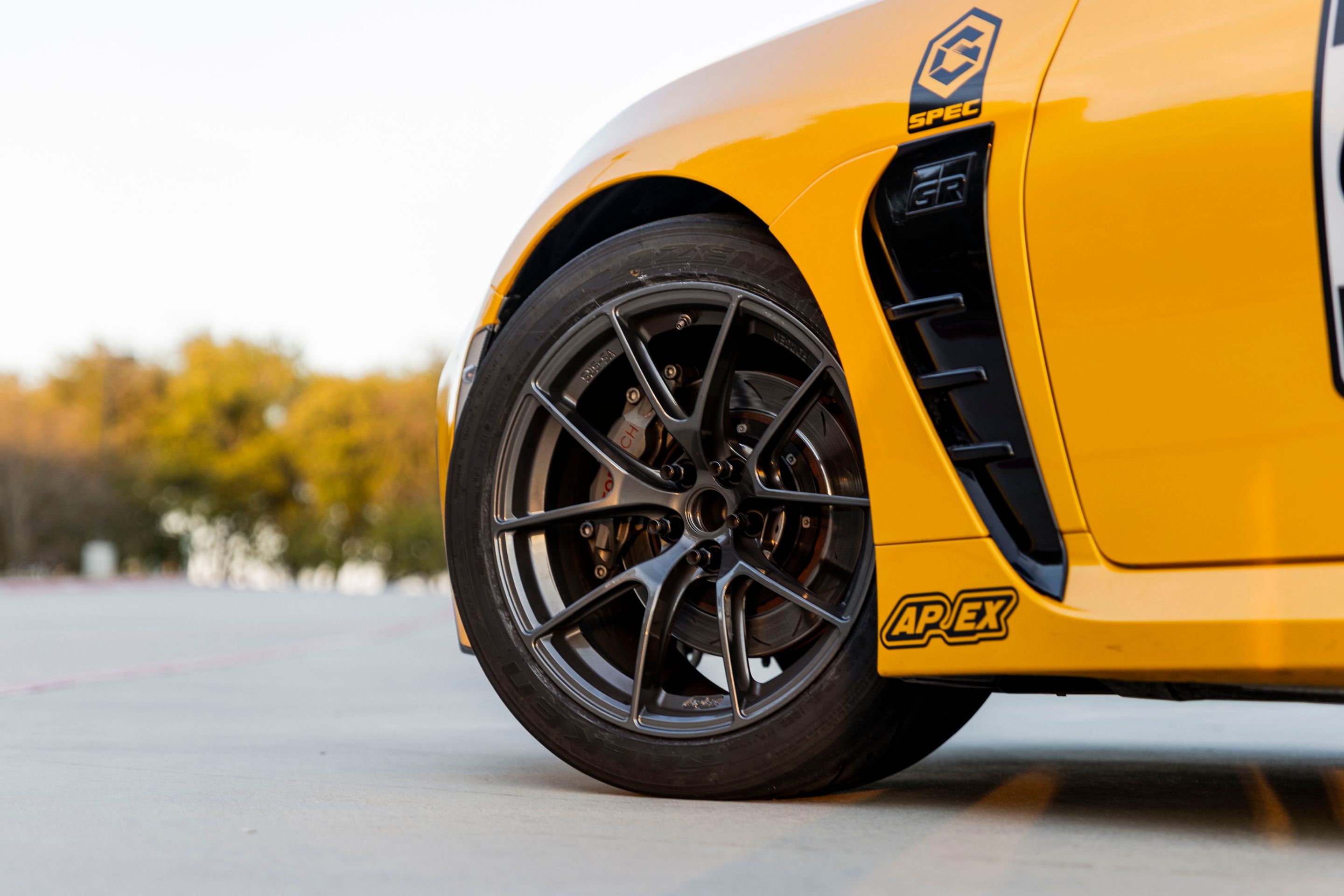 Yellow Toyota GR86 with 17" VS-5RS Apex wheels in Anthracite