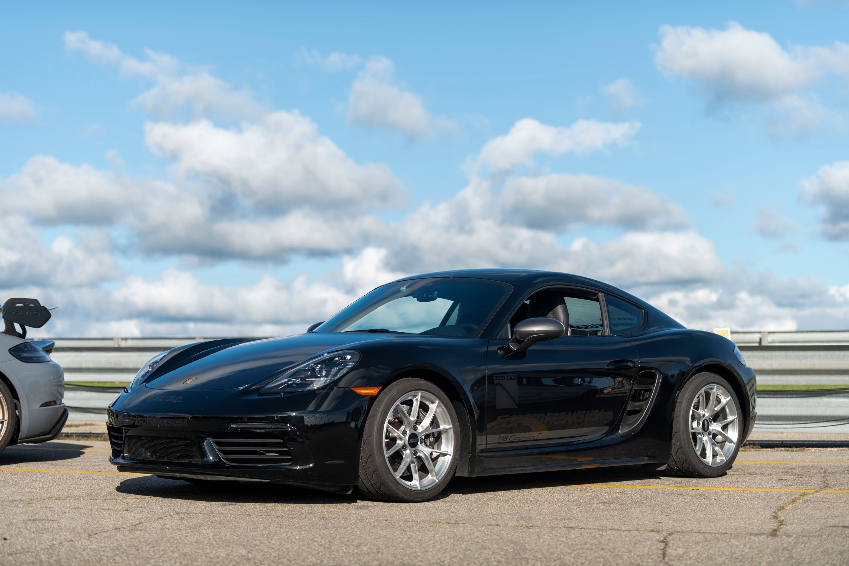 Black Porsche 718 Cayman T with 18" VS-5RS Apex wheels in Brushed Clear