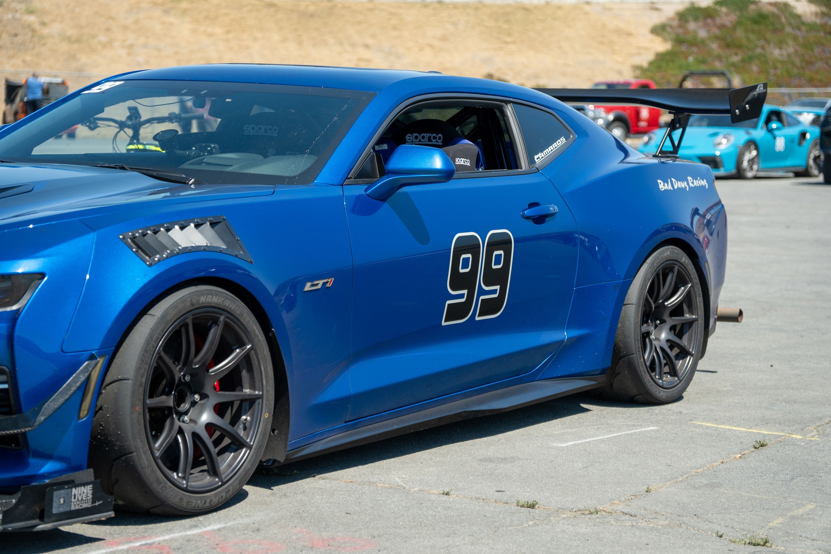 Blue Chevrolet 6th Gen Camaro SS with 18" SM-10 Apex wheels in Satin Black