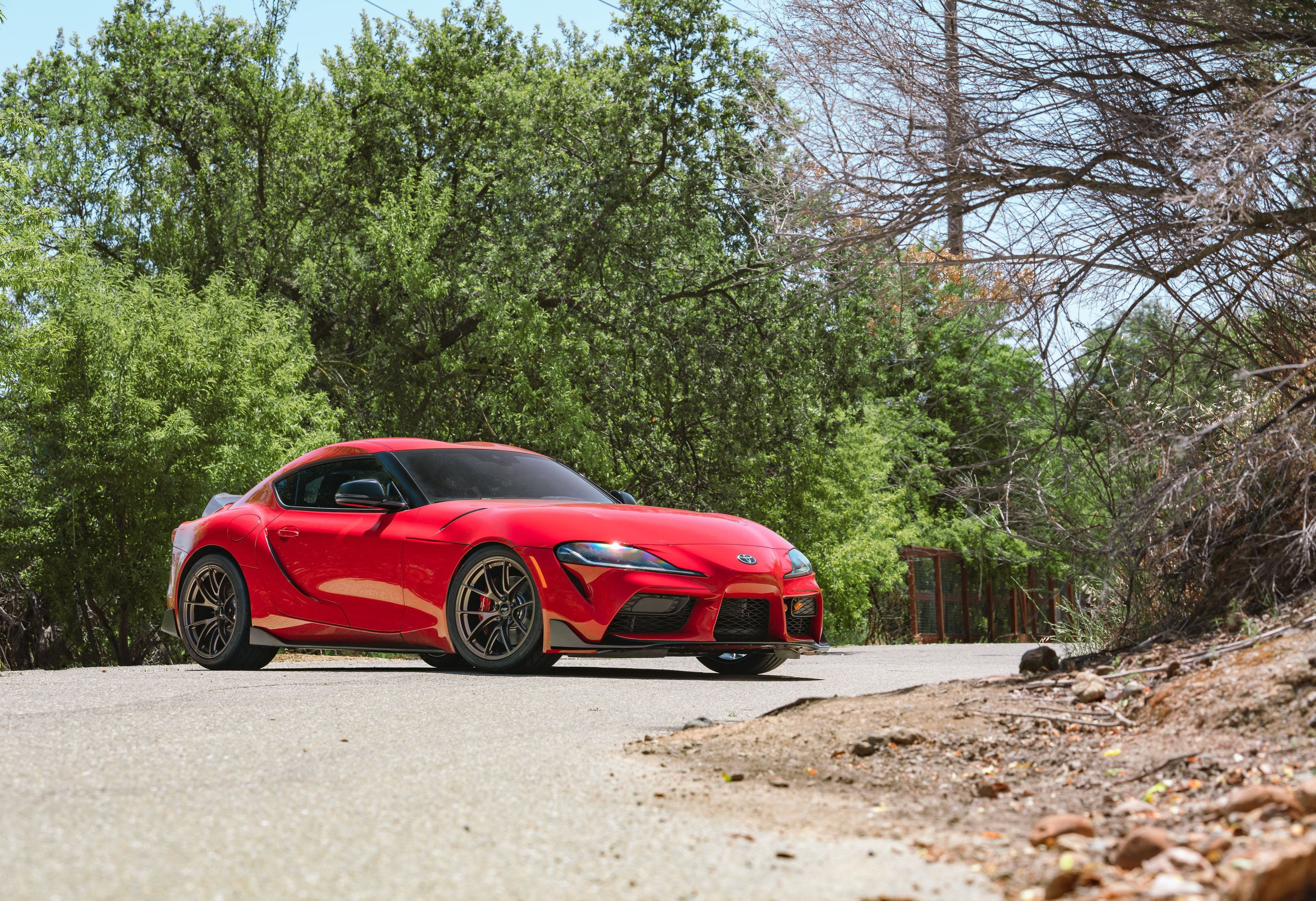 Red Toyota GR Supra with 19" VS-5RS Apex wheels in Satin Bronze