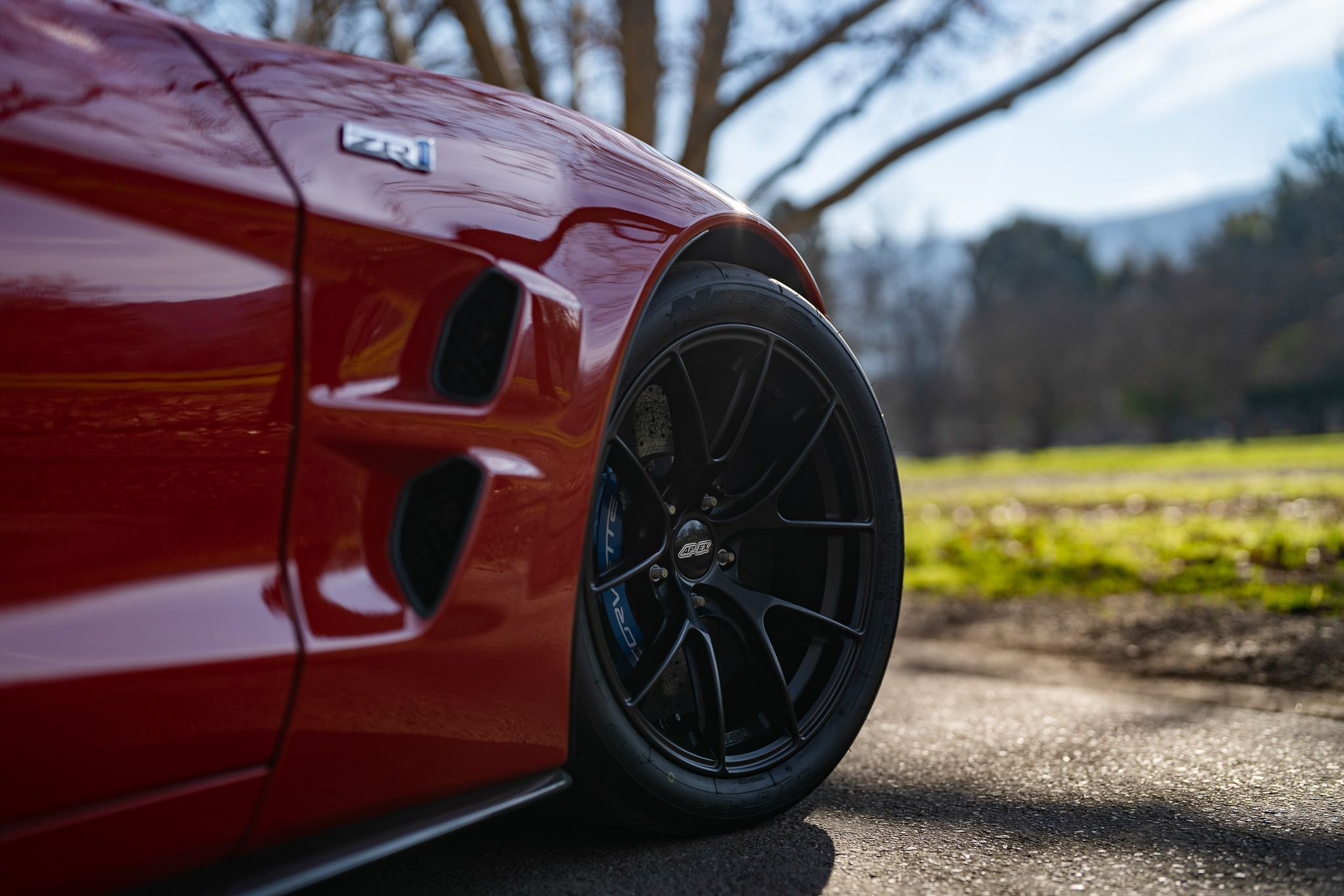 Red Chevrolet C6 Corvette ZR-1 with 19" VS-5RS Apex wheels in Satin Black