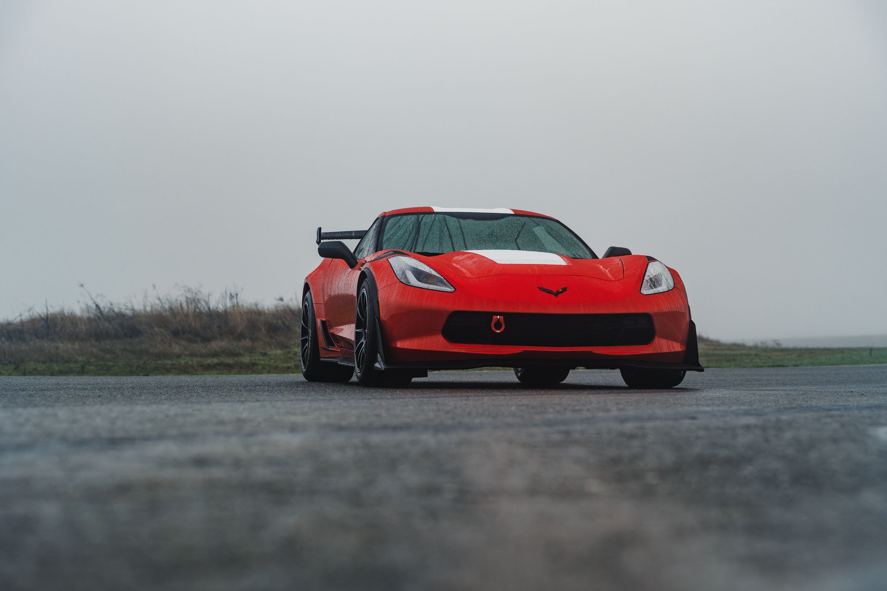 Red Chevrolet C7 Corvette Grand Sport with 18" SM-10RE Apex wheels in Satin Black