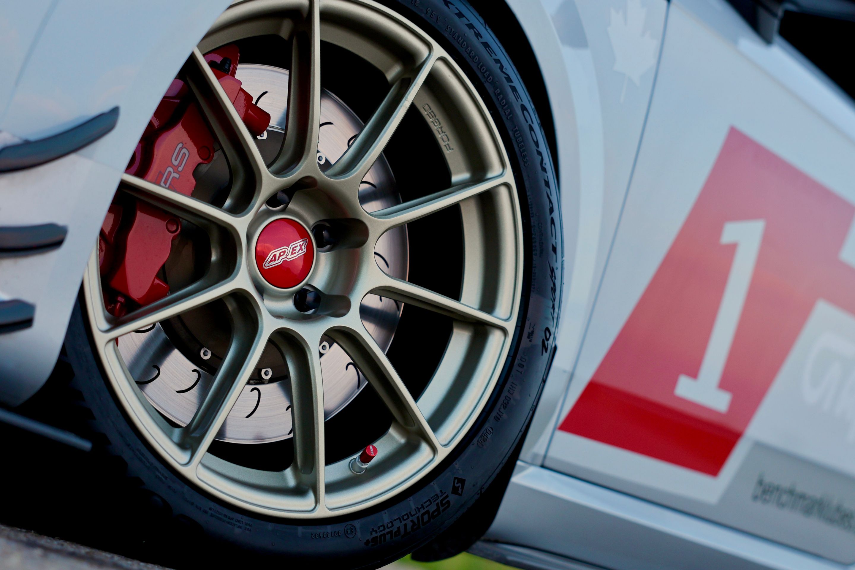 White Audi FV/8S TT RS with 18" SM-10RS Apex wheels in Motorsport Gold