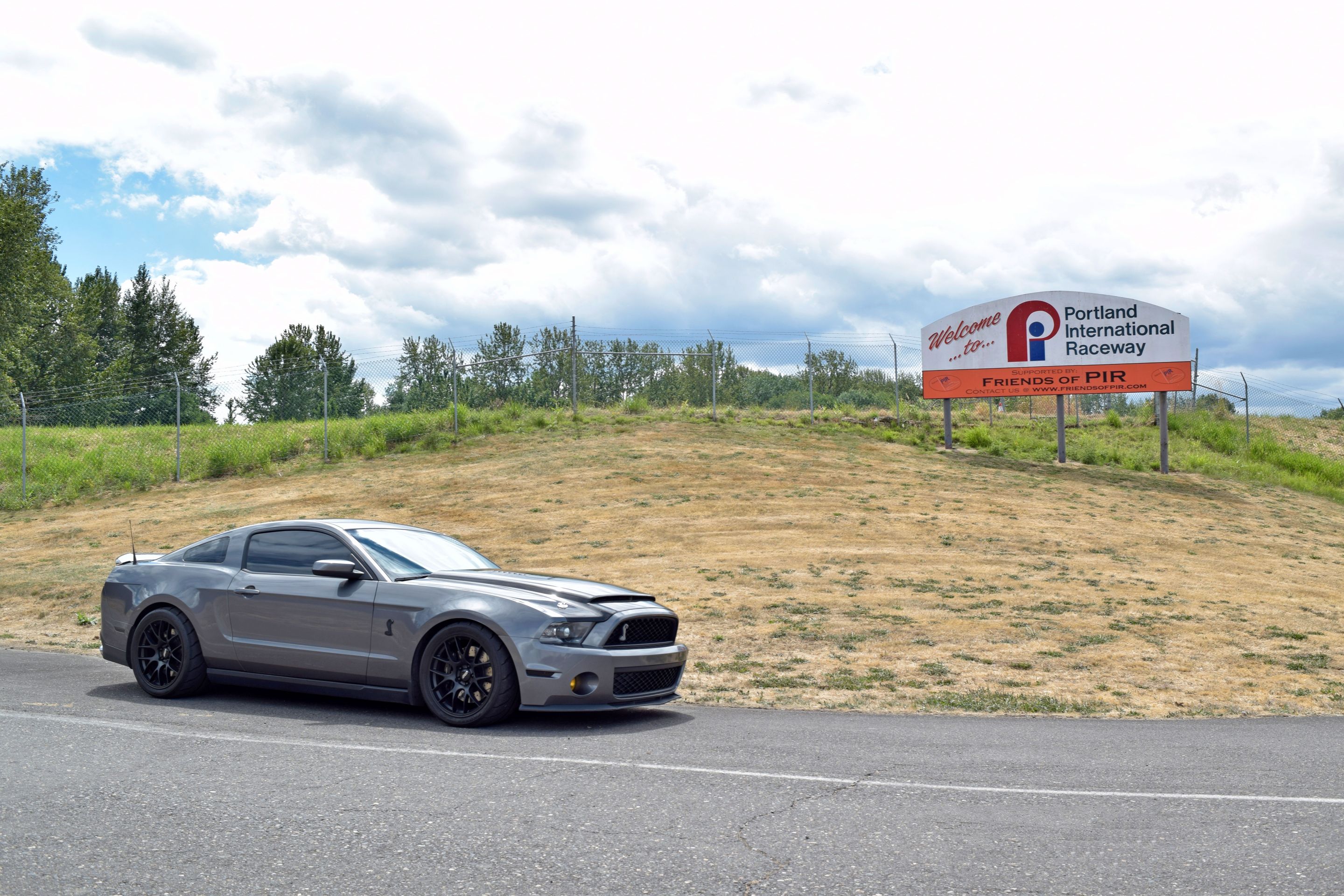 Grey Ford S197 Mustang GT500 with 19" EC-7 Apex wheels in Satin Black