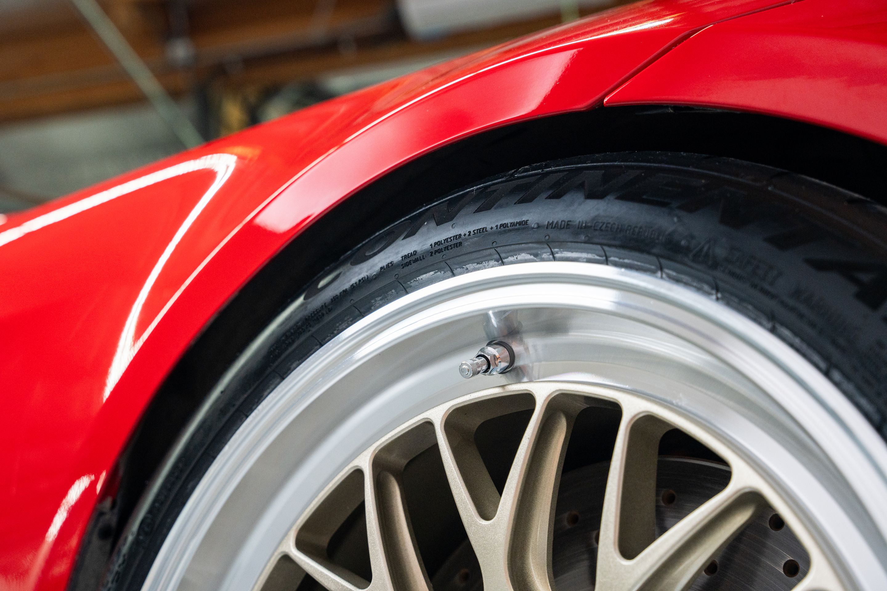 Red BMW E90 Sedan 3 Series with 18" ML-10RT Apex wheels in Machined Lip Gloss Motorsport Gold