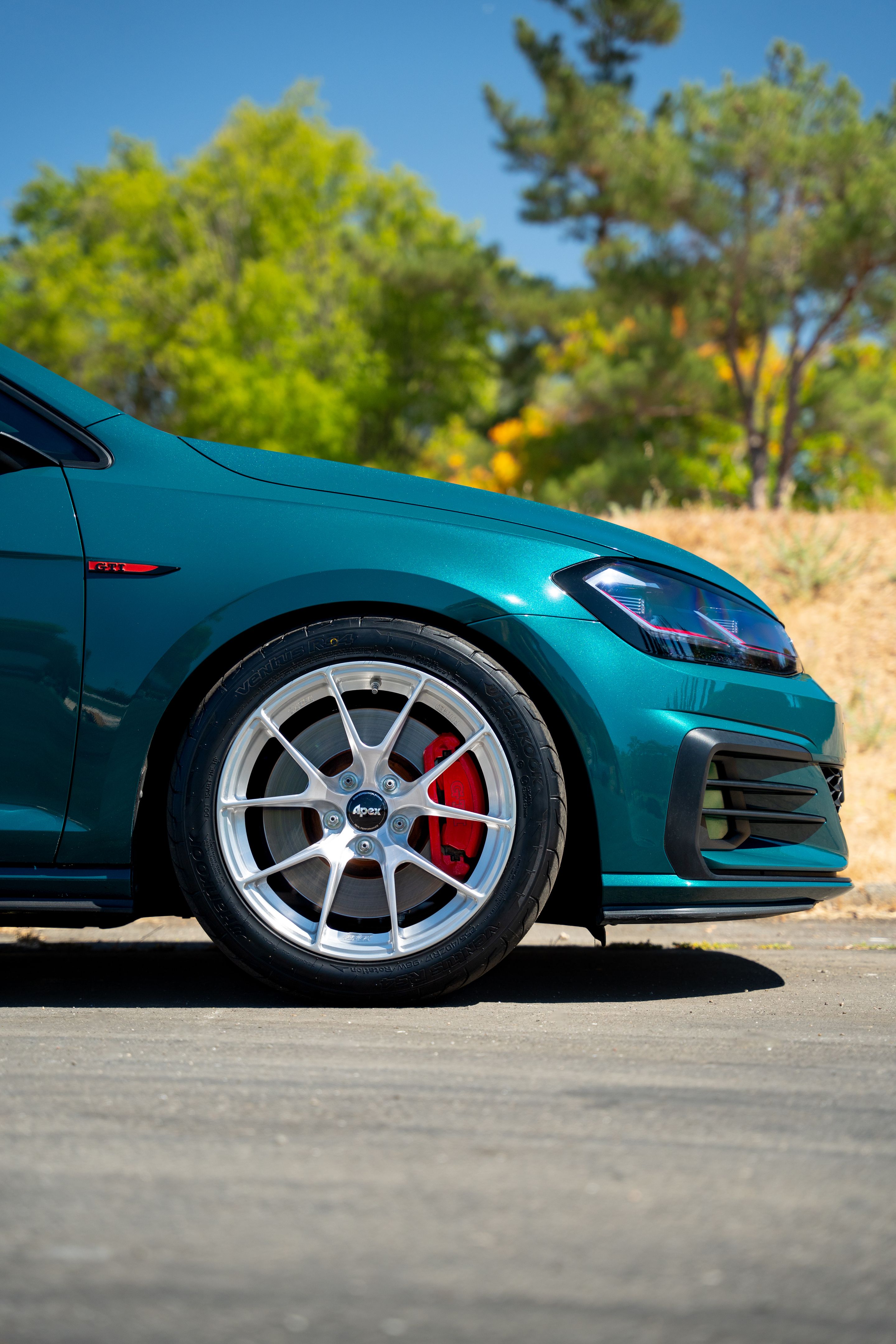 Green VW MK7 GTI with 17" VS-5RS Apex wheels in Brushed Clear