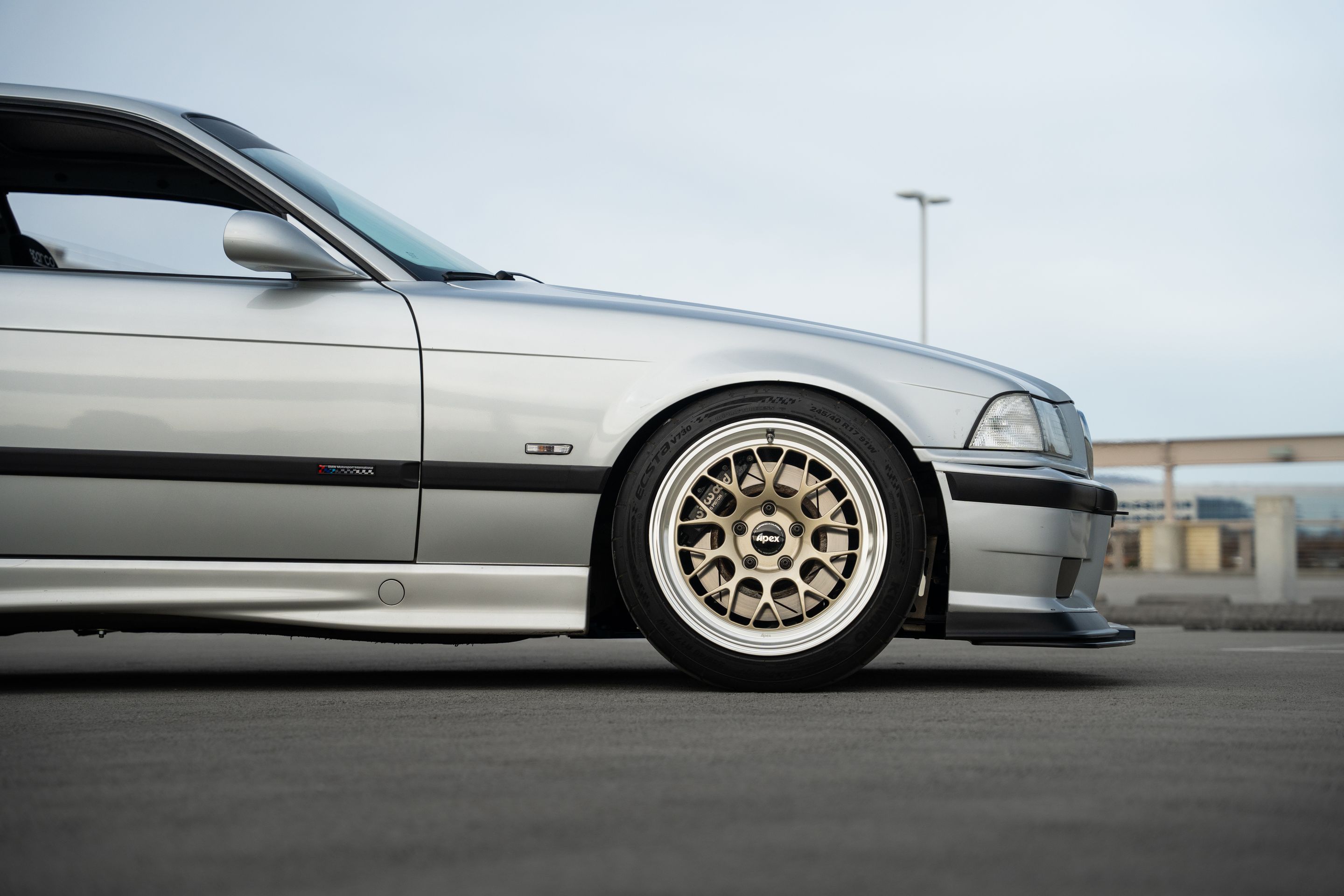 Silver BMW E36 3 Series with 17" ML-10RT Apex wheels in Machined Lip Gloss Motorsport Gold