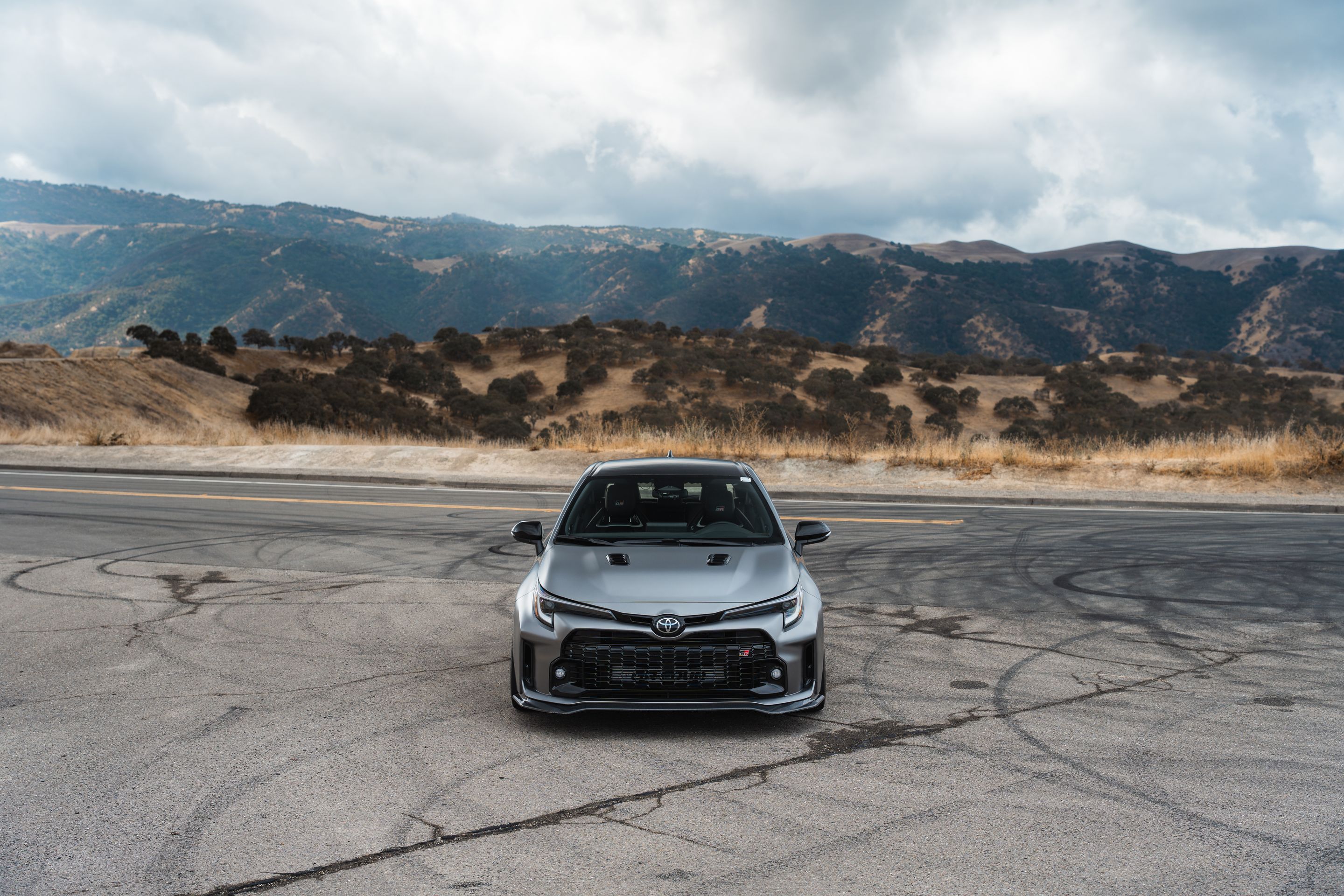 Grey Toyota GR Corolla with 18" SM-10RS Apex wheels in Satin Bronze
