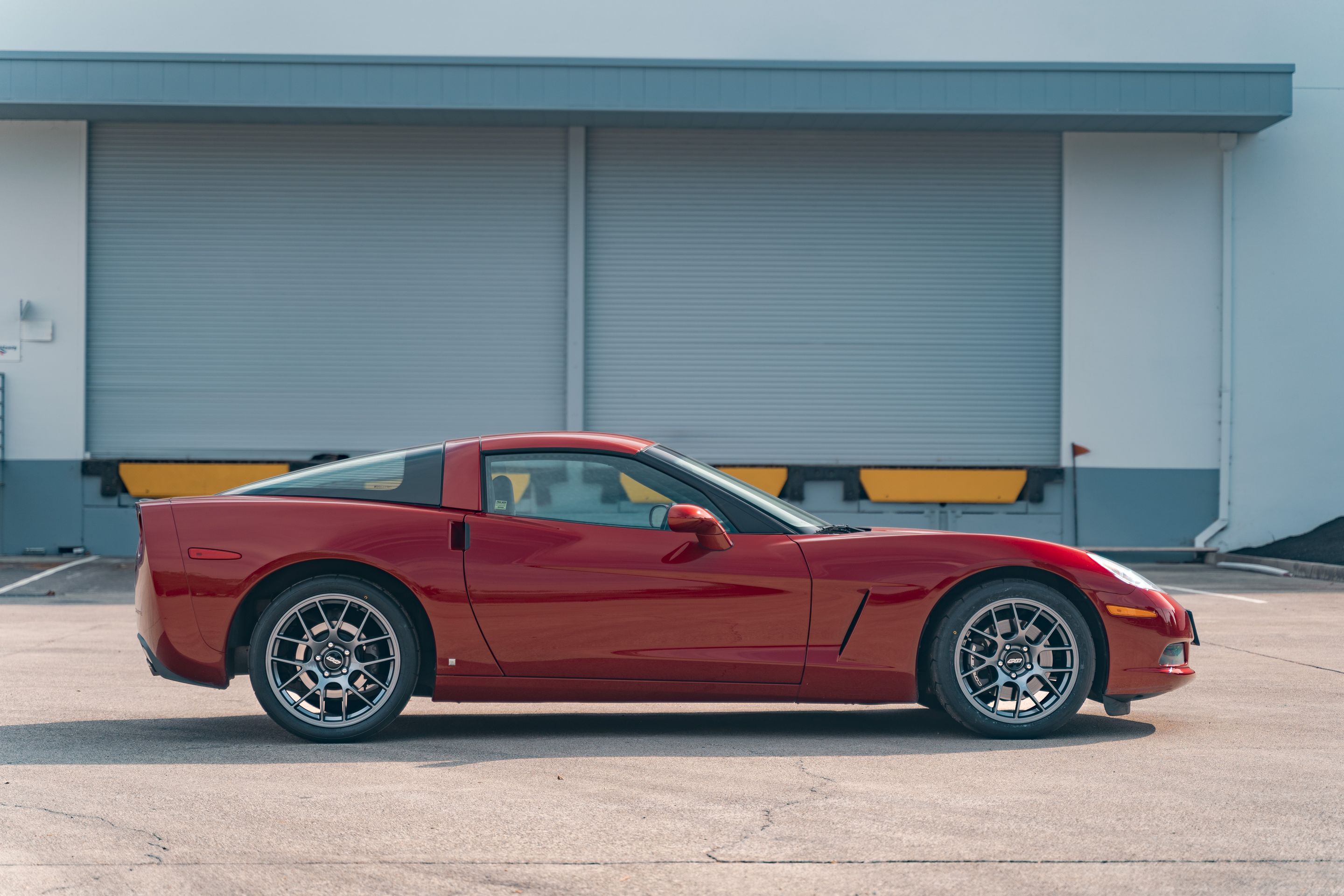 Red Chevrolet C6 Corvette Base/Z51 with 18"/19" EC-7 Apex wheels in Anthracite