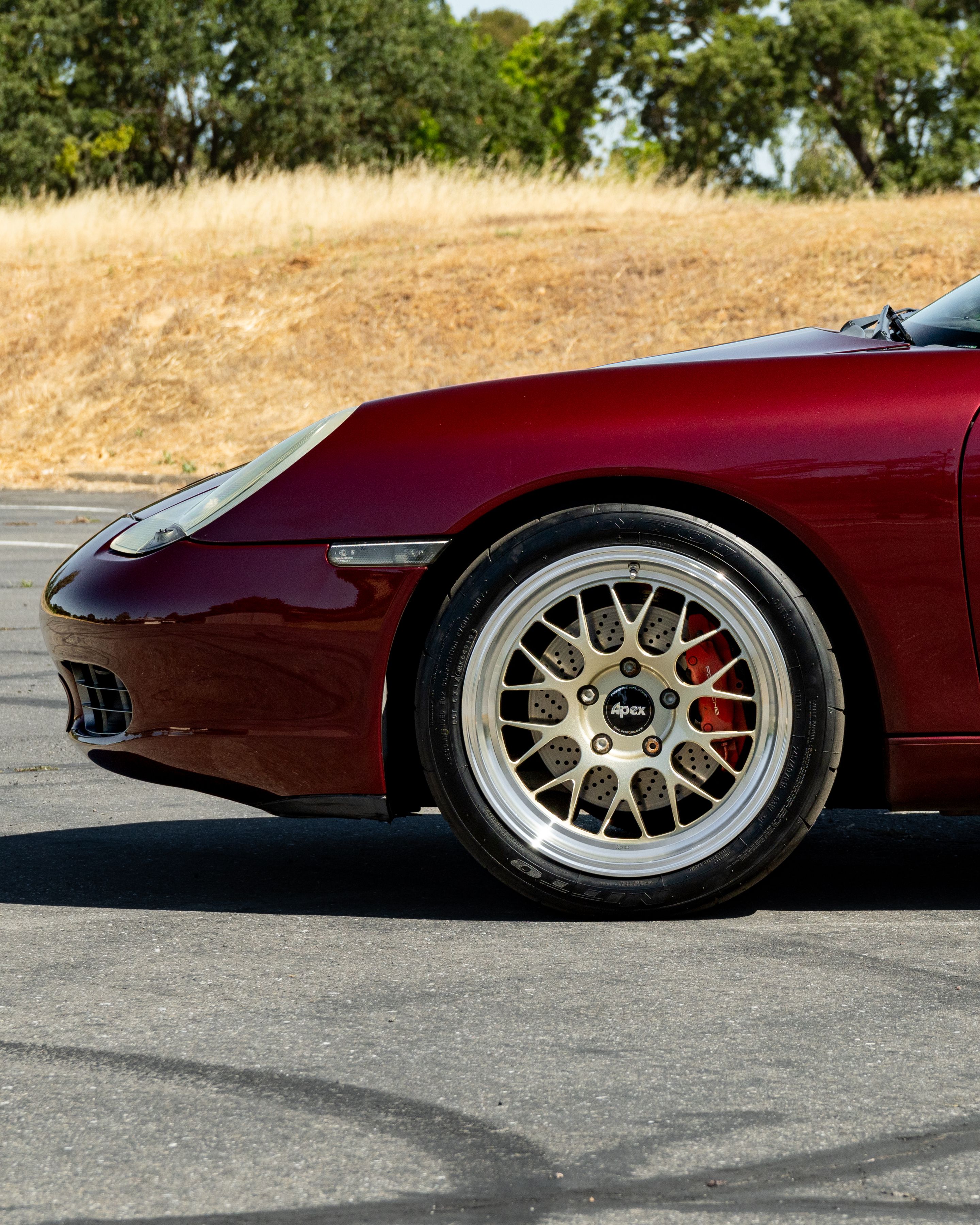 Red Porsche 986 Boxster with 18" ML-10RT Apex wheels in Machined Lip Gloss Motorsport Gold