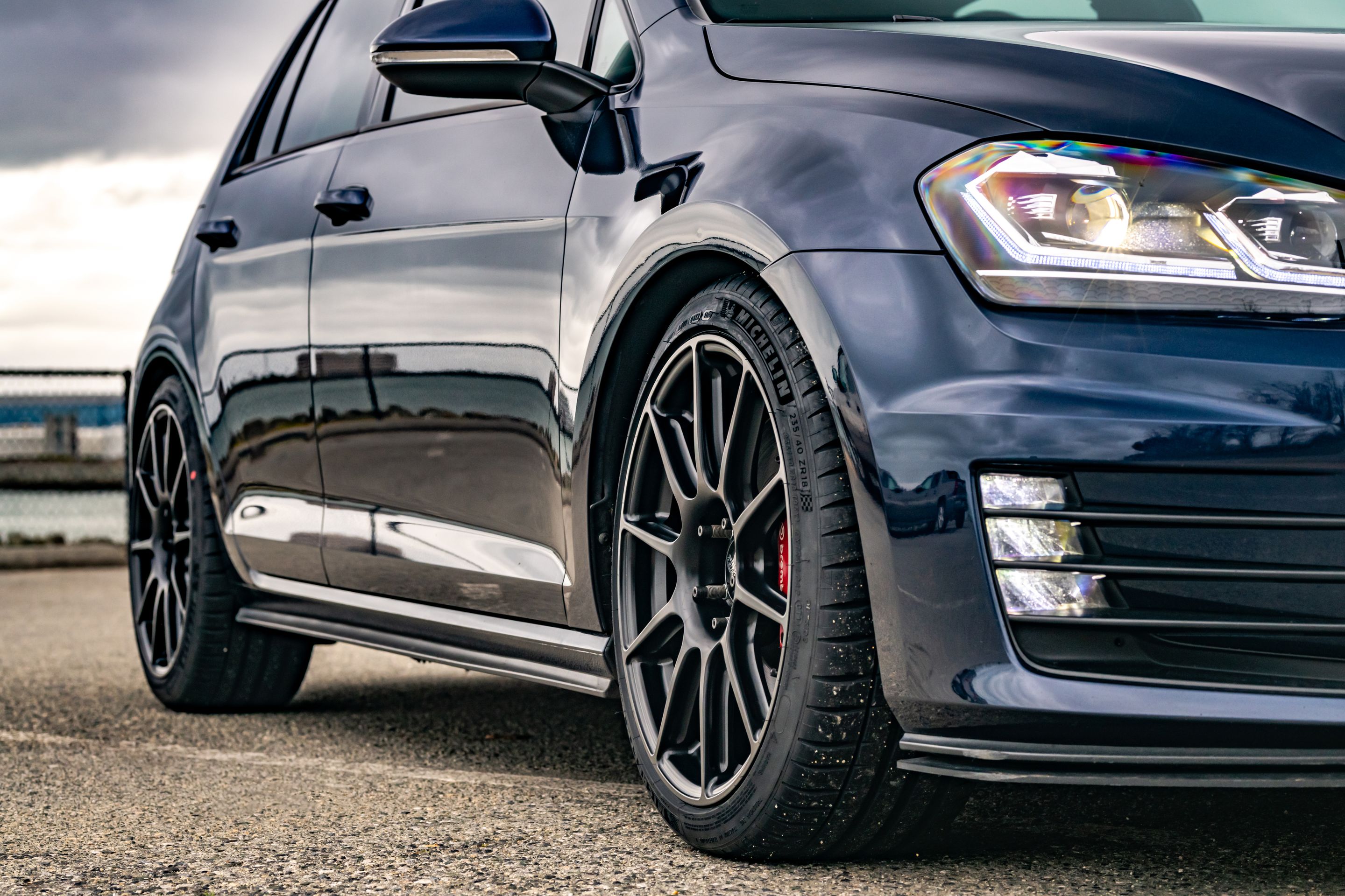 Blue VW MK7 GTI with 18" SM-10 Apex wheels in Satin Black