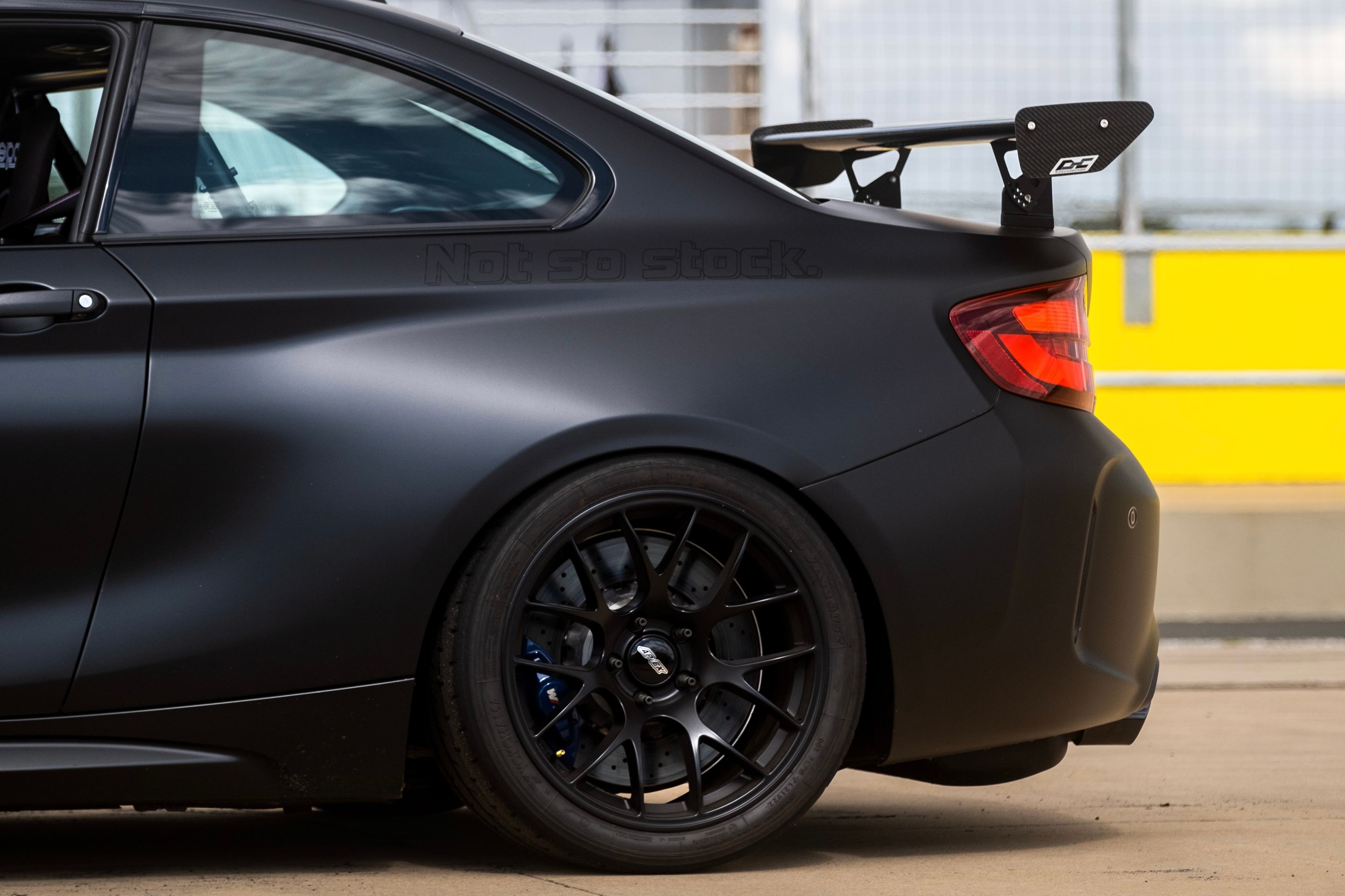 Black BMW F87 M2 with 18" EC-7 Apex wheels in Satin Black